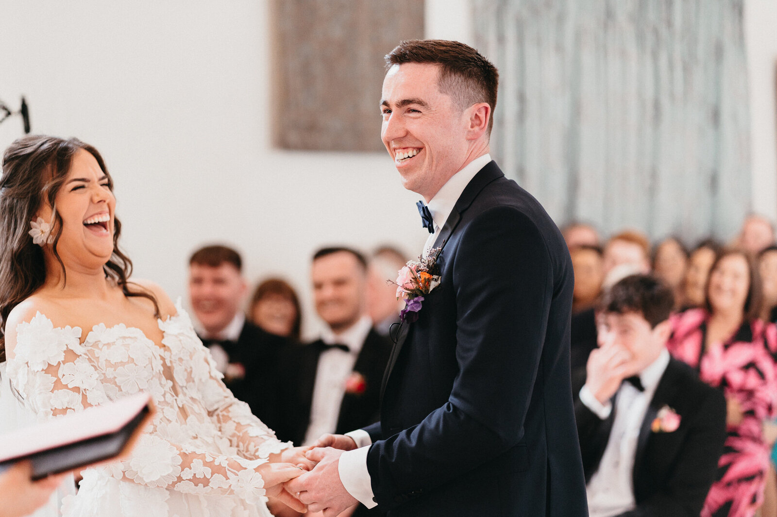 Bride and groom laughing at the wedding alter at Castle Dargan in Sligo, Ireland