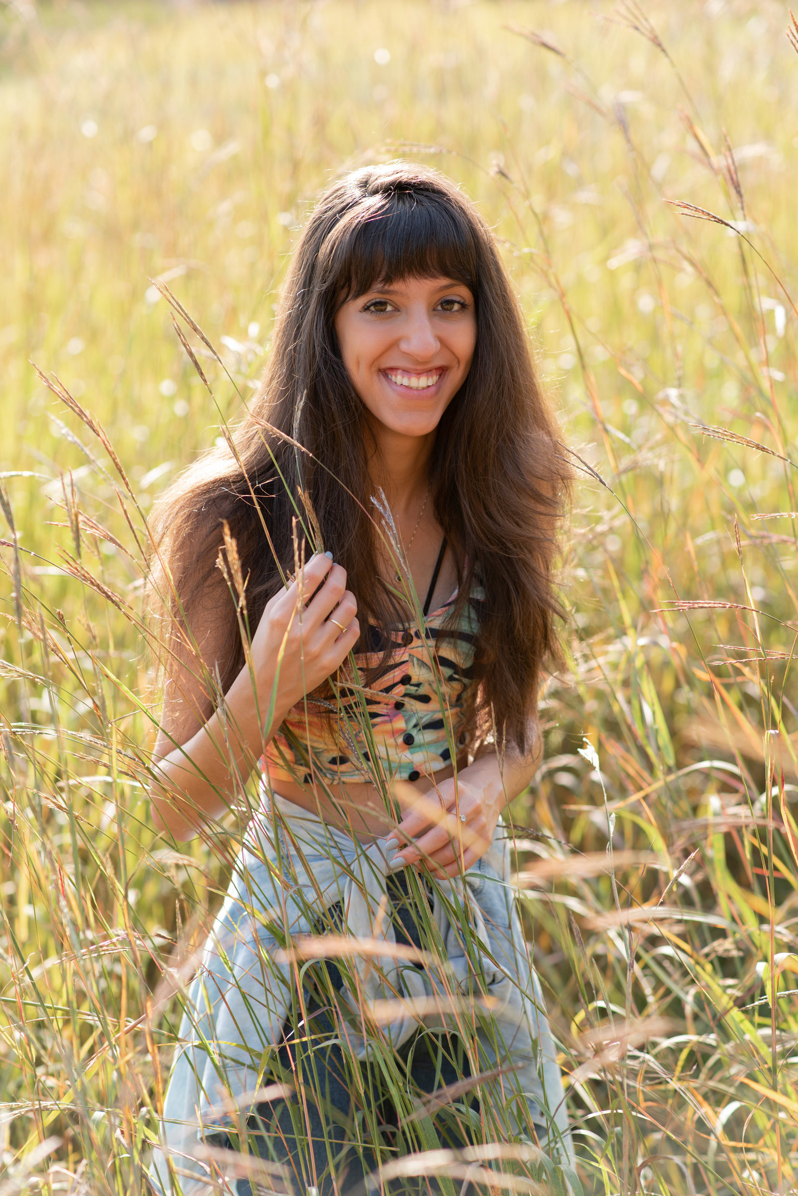 Senior girl in golden tall grass