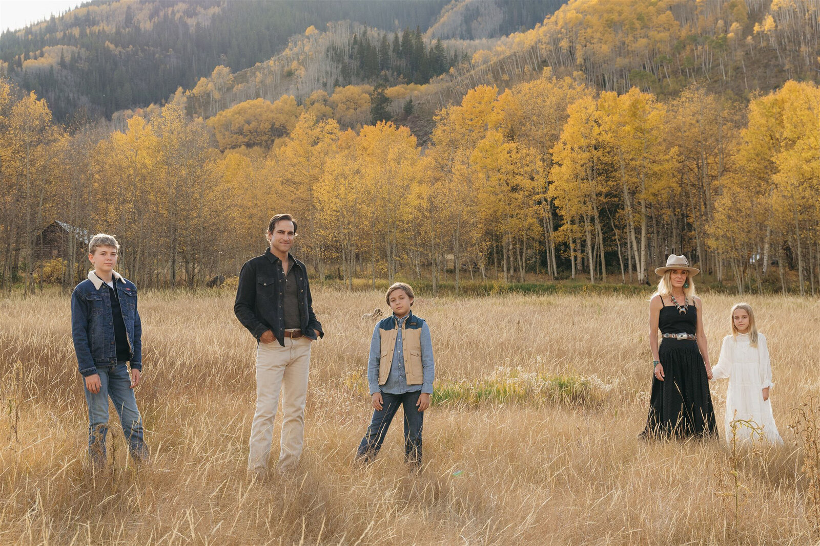 Editorial Aspen family photography — stylish family walking together in classic Ralph Lauren–inspired outfits.