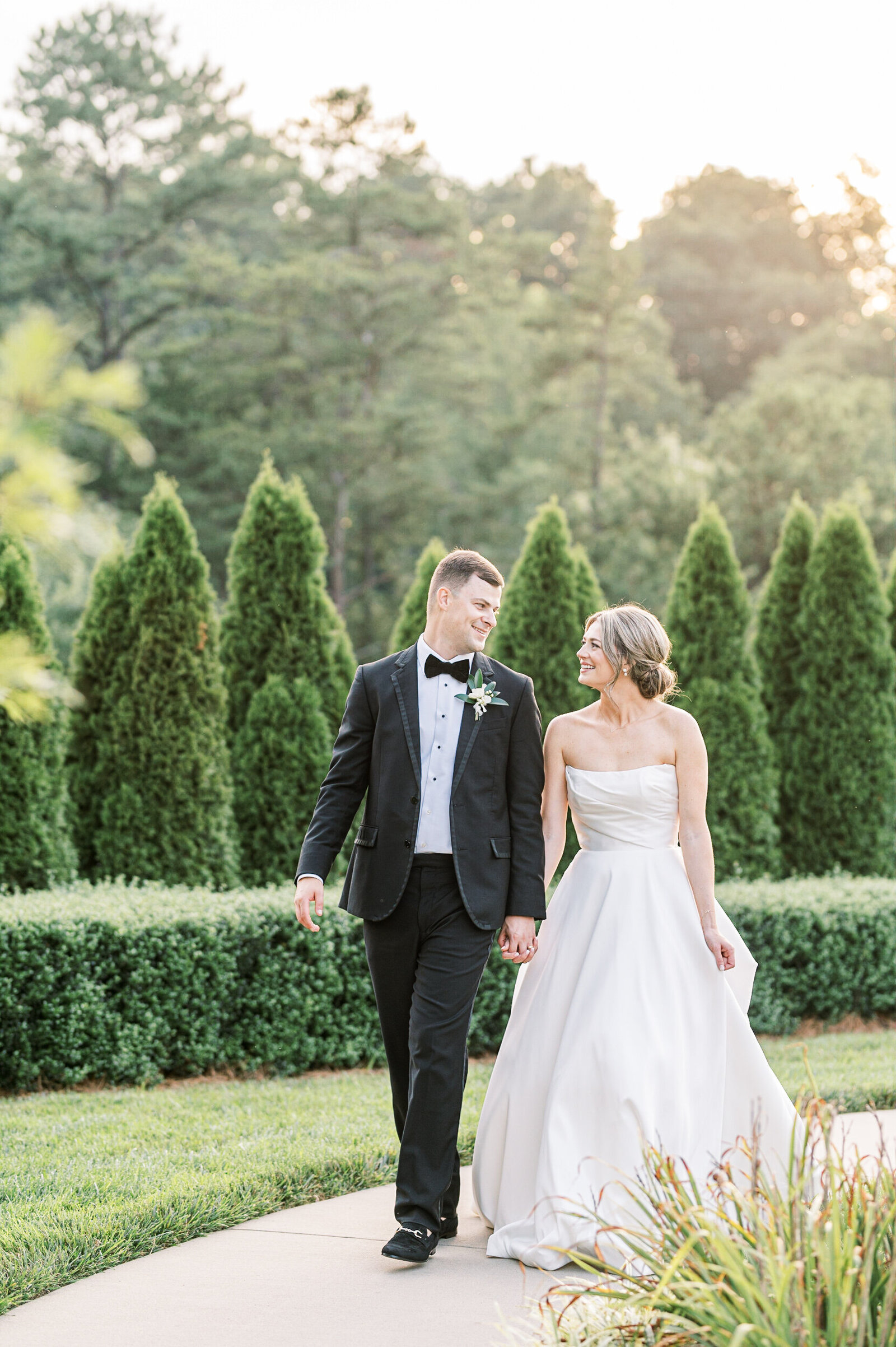 bride and groom walking elegant summer mountain wedding Chestnut Ridge Asheville NC