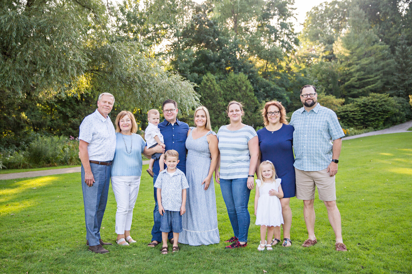 extended family wearing blue at golden hour