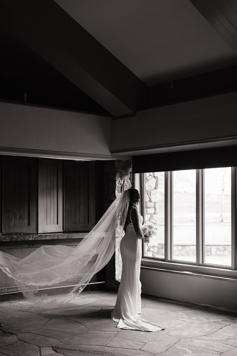 bride in front of windows by idaho elopement photographer
