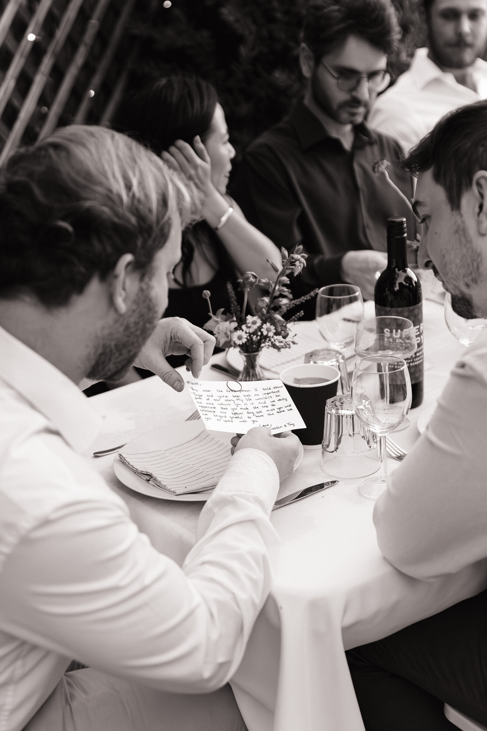 Guests read personal notes from bride and groom at Santa Barbara wedding reception