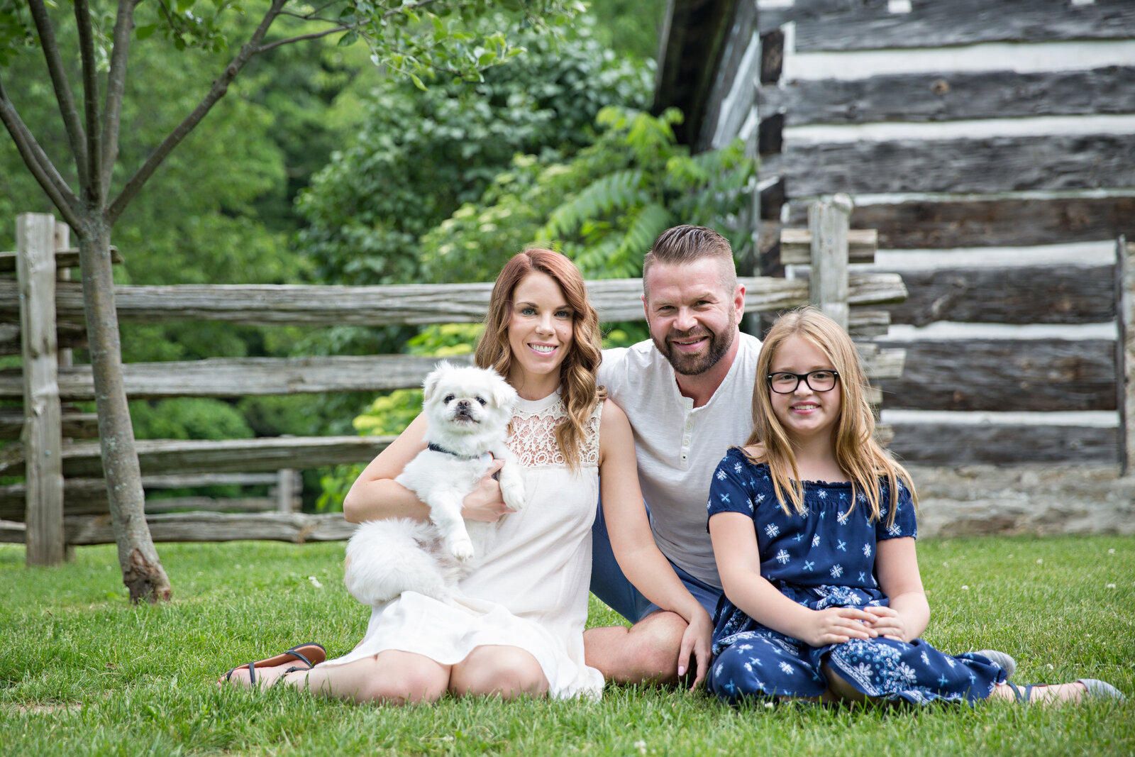 family with little white dog