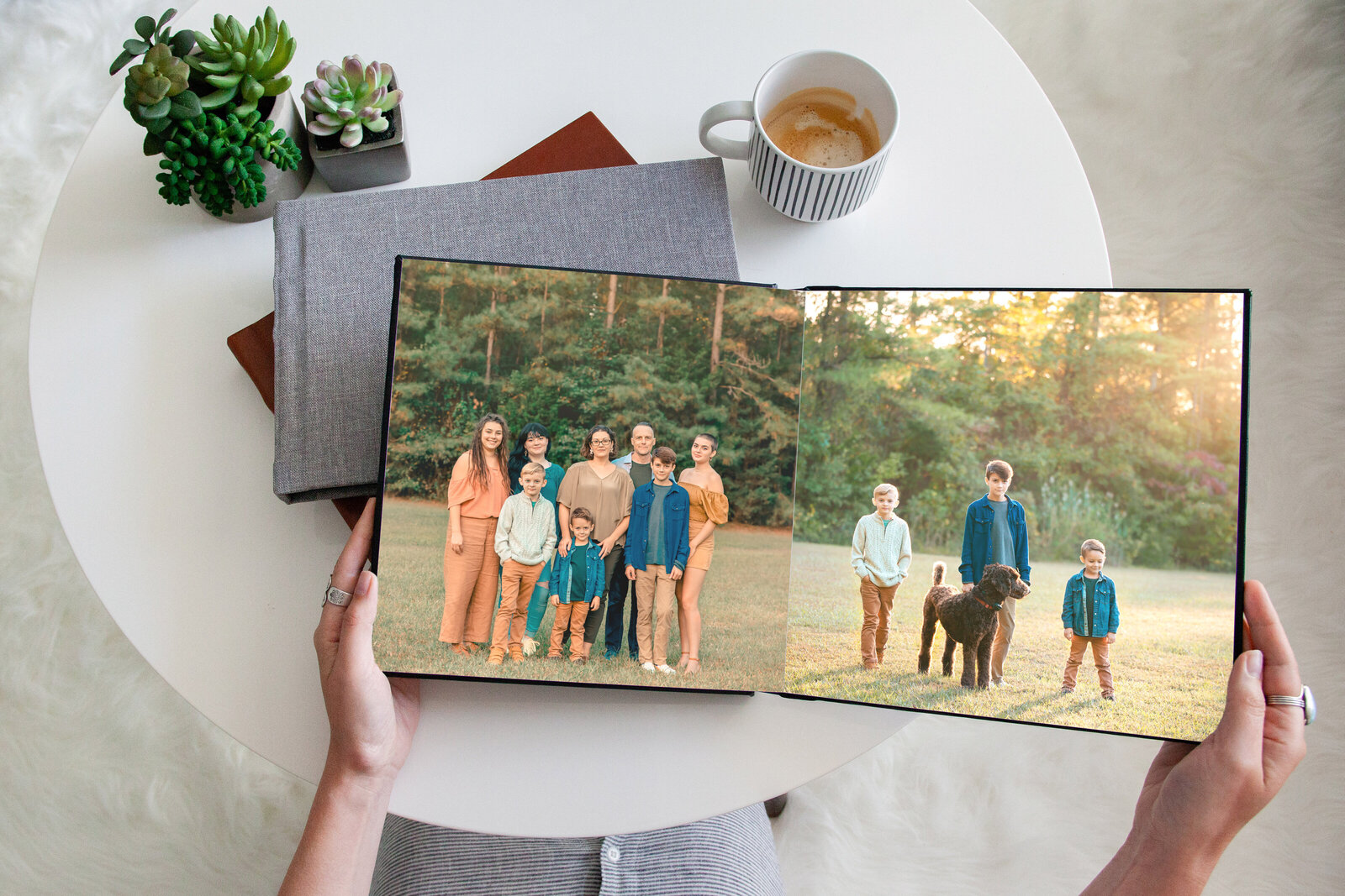 Family heirloom photo album with pictures of extended family and siblings being held on top of the coffee table photographed by Family photographer Hampton Roads va