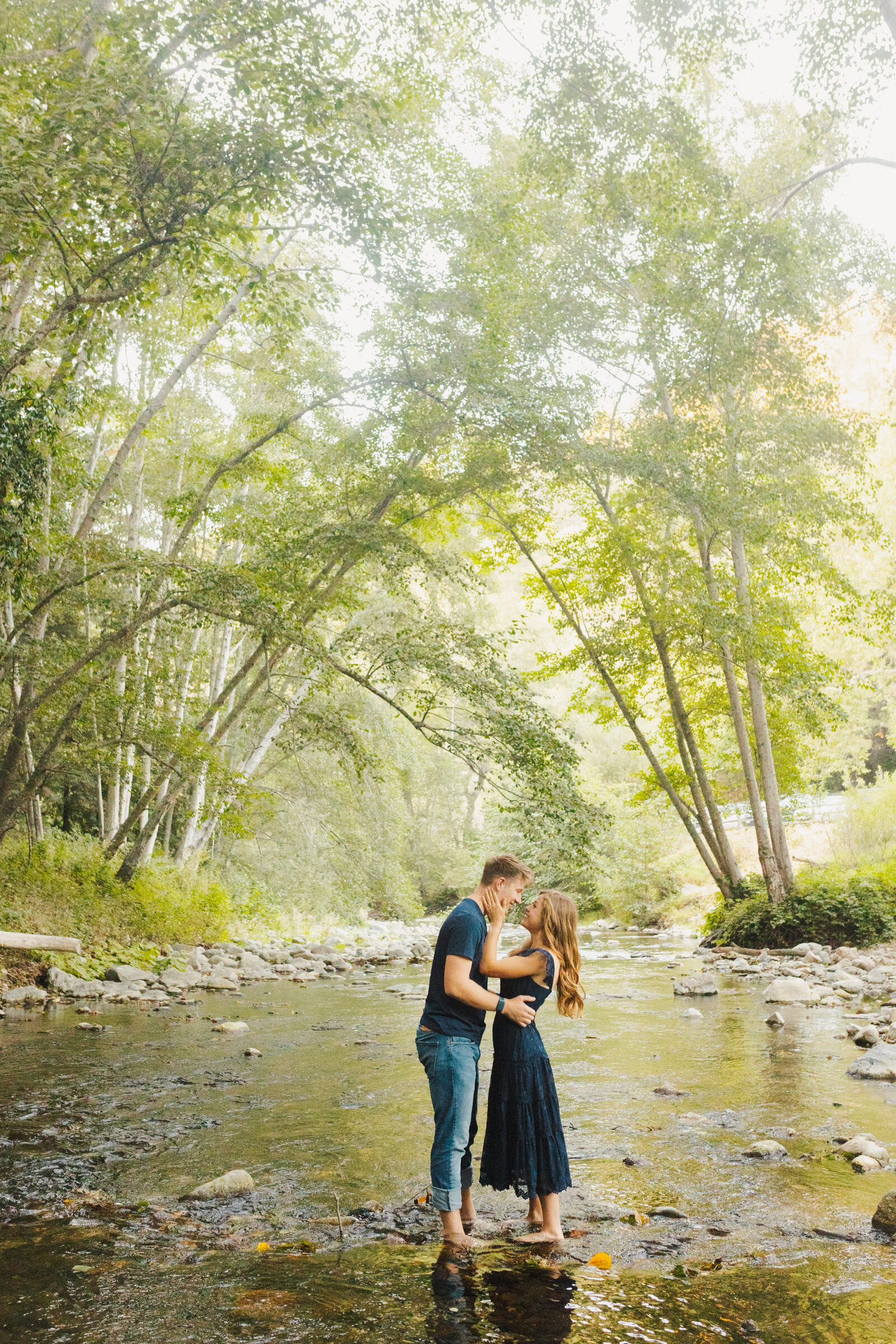 A couple poses for their engagement photos in Big Sur, California.