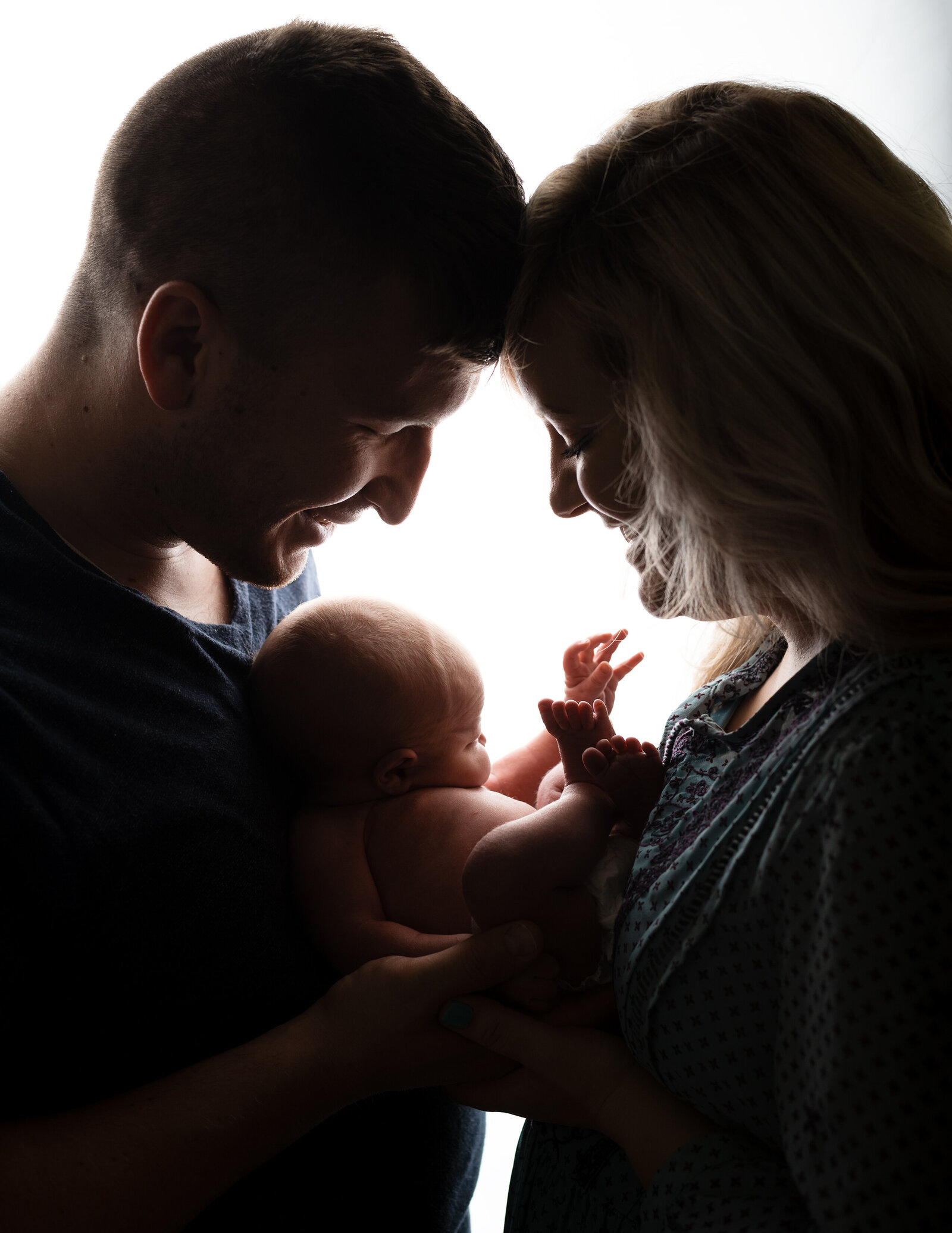 newborn baby backlit photo with family in utah county