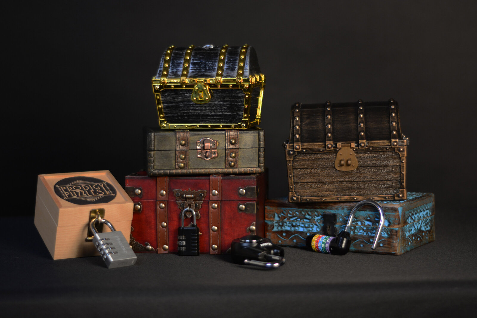 a collection of puzzle chests with locks and the Prodigy Puzzle logo