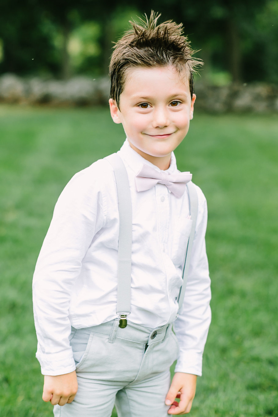 adorable ringbearer with bowtie and suspenders