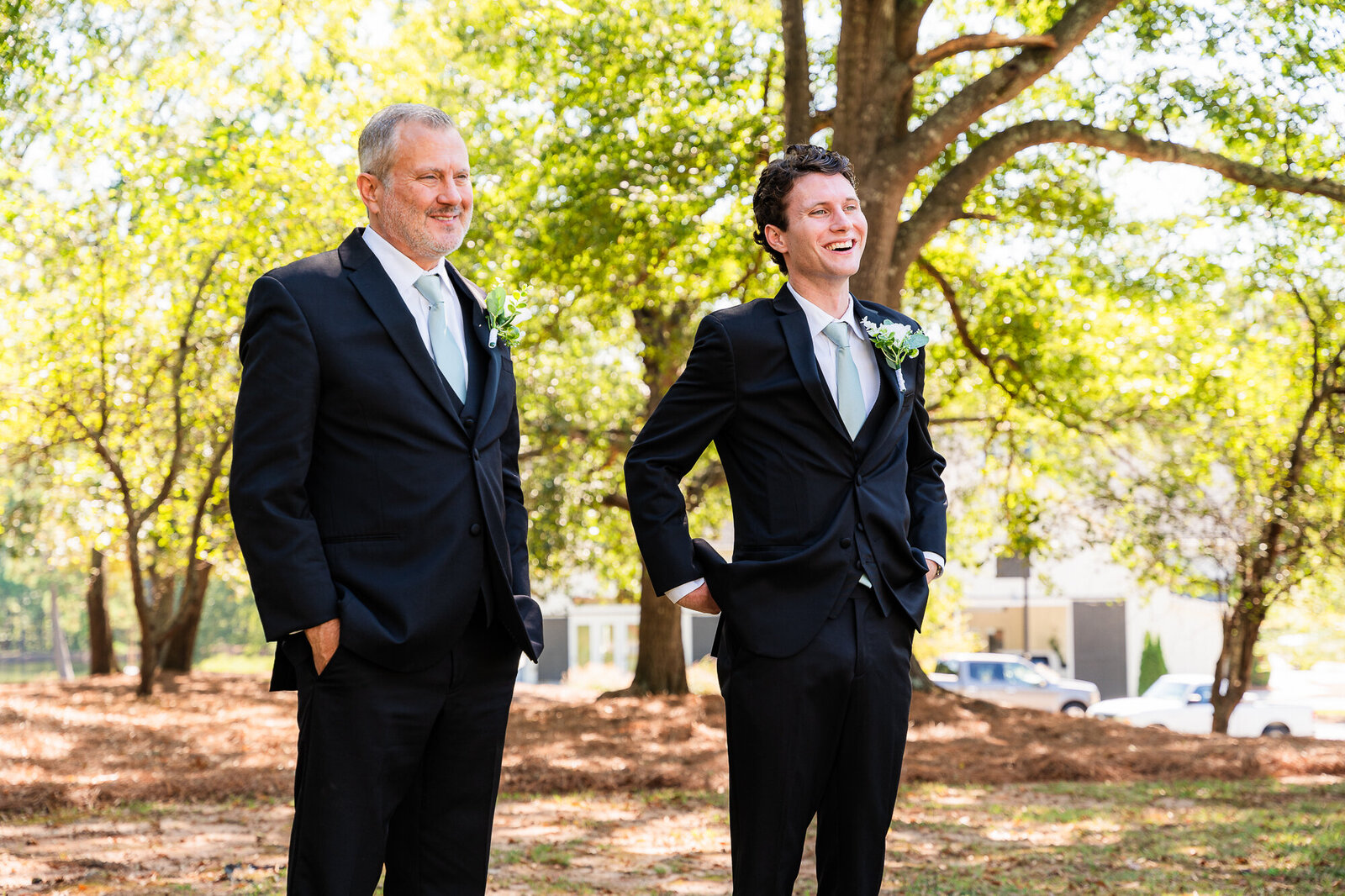 Father and brother of the bride are getitng ready for the reveal with her at the wedding venue at Daisy Hill