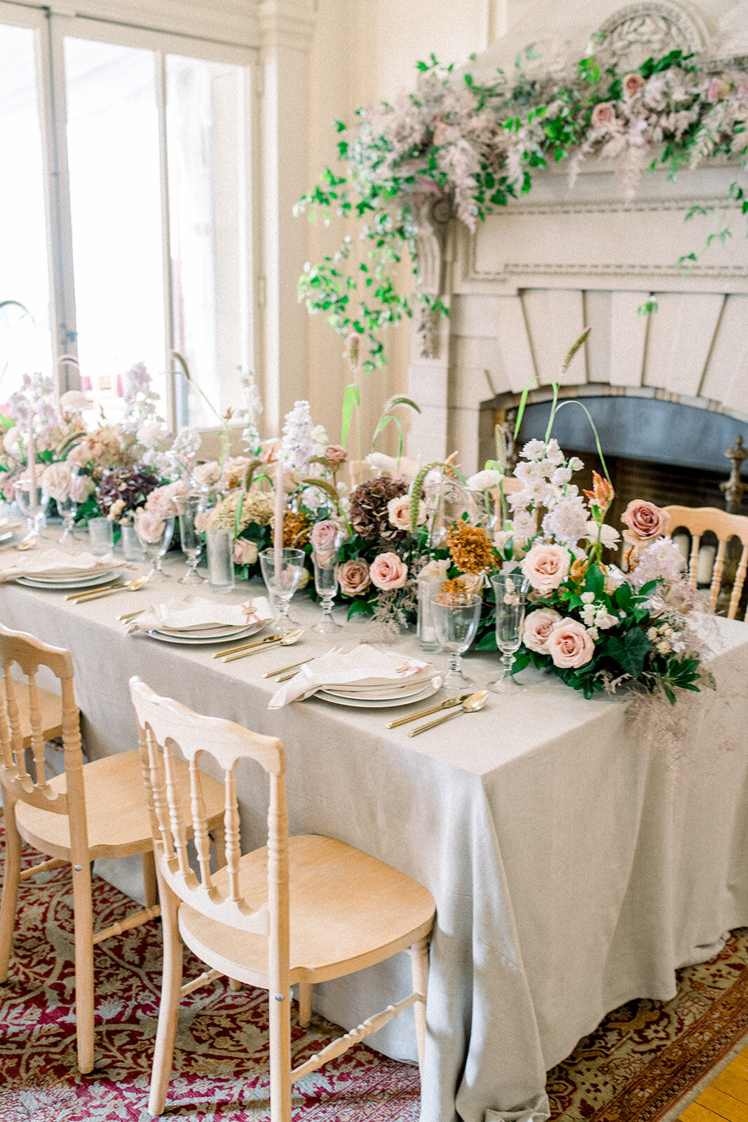 A stunningly decorated reception table, showcasing the elegance and charm of a wedding held at the Filoli estate in Woodside, California.