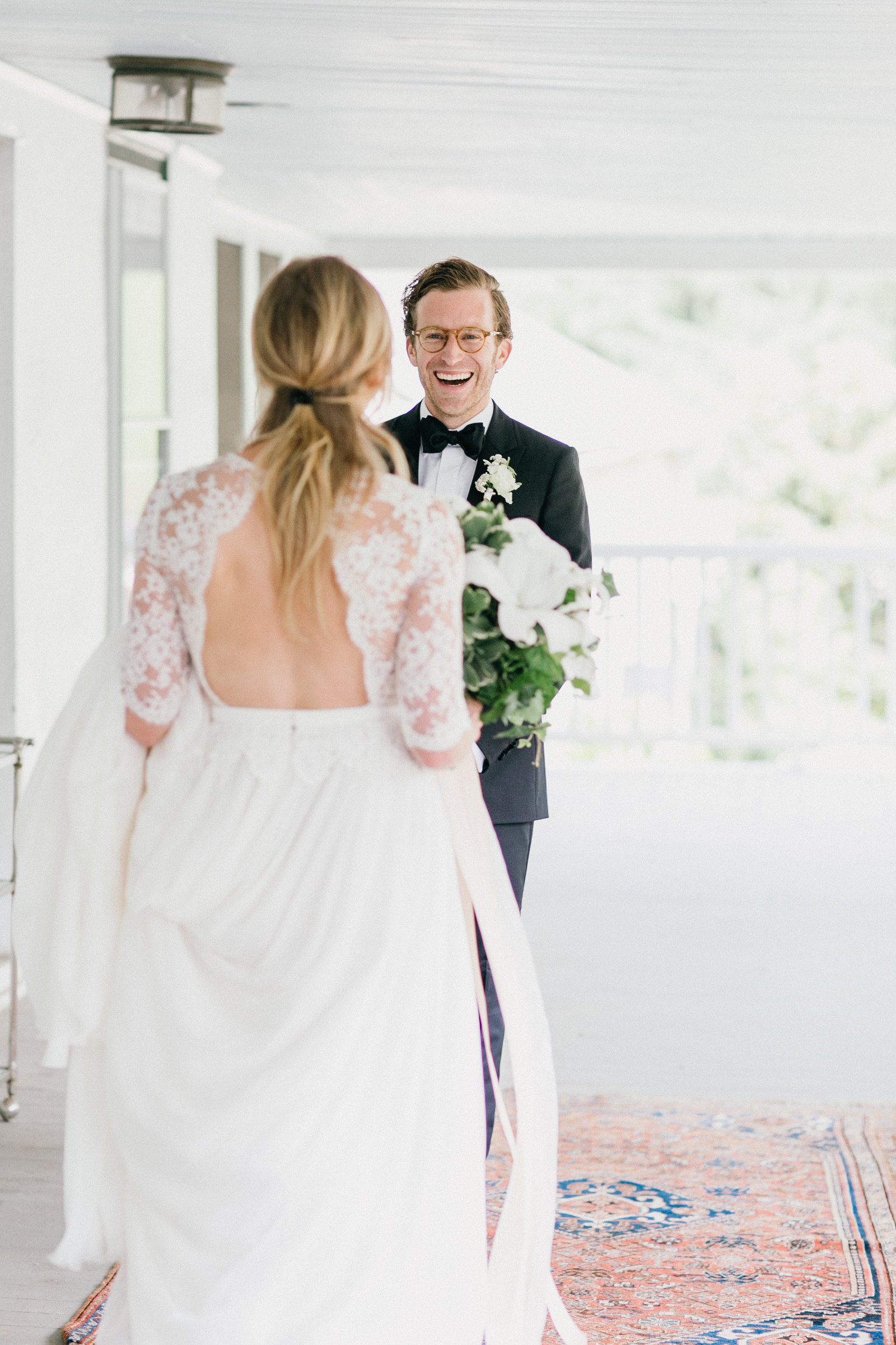Groom seeing his bride in her dress for the first time!