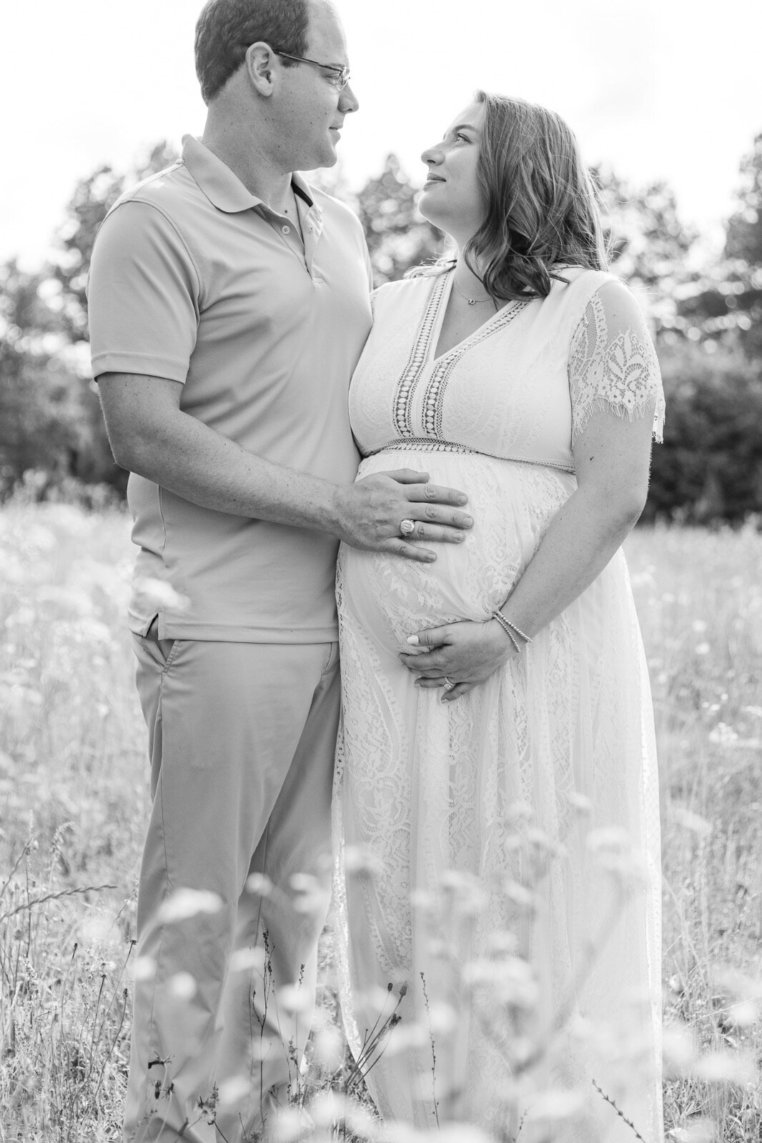 Couple looking at each other in a field