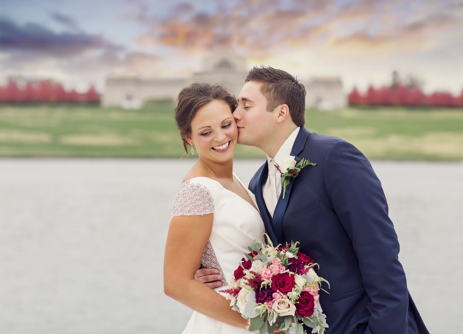 Bride and Groom, Suzie and Ale, pose at sunset in from the St. Louis Art Museum Grand Basin by Jackelynn Noel Photography