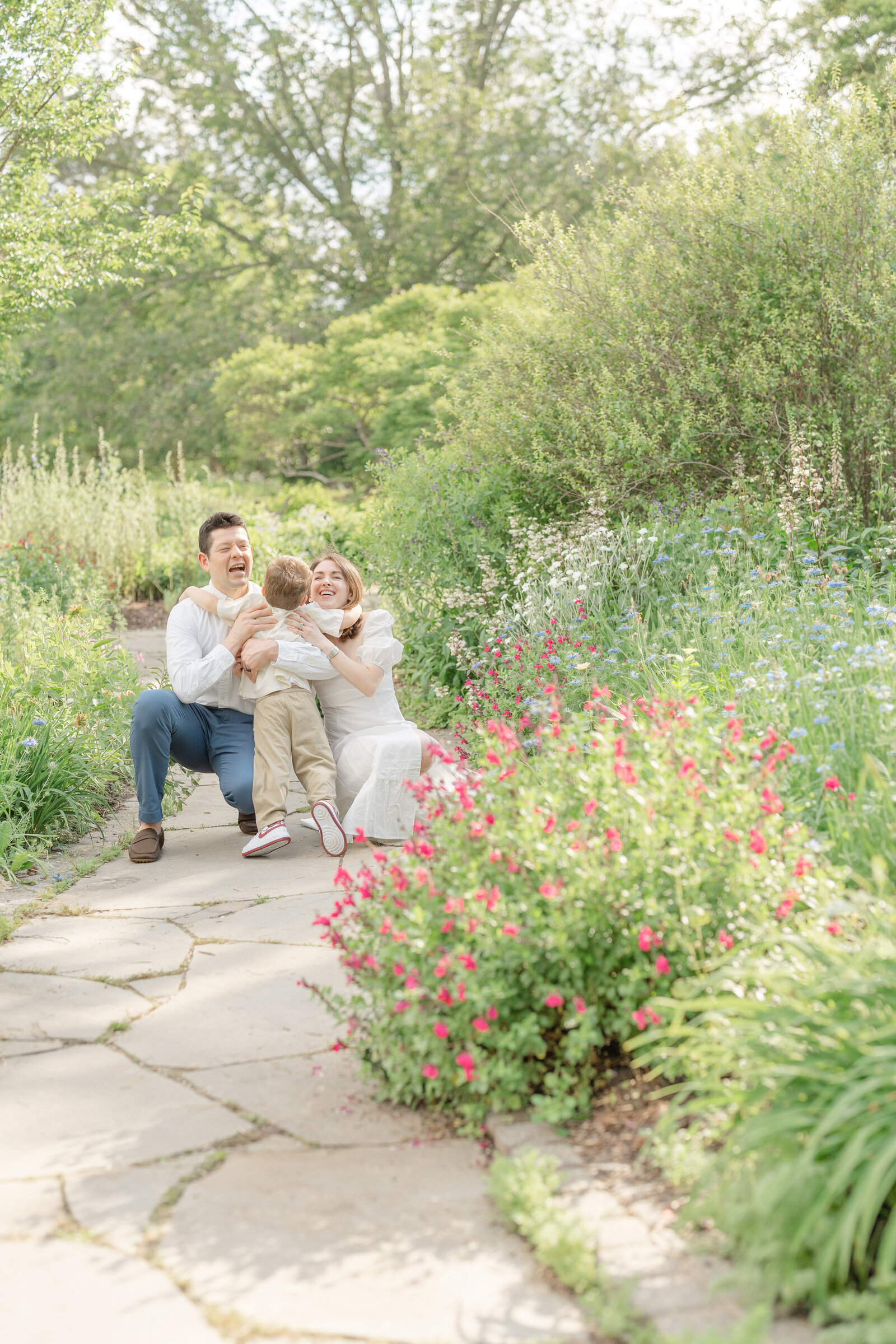 son hugs parents during family photo in Chantilly,VA