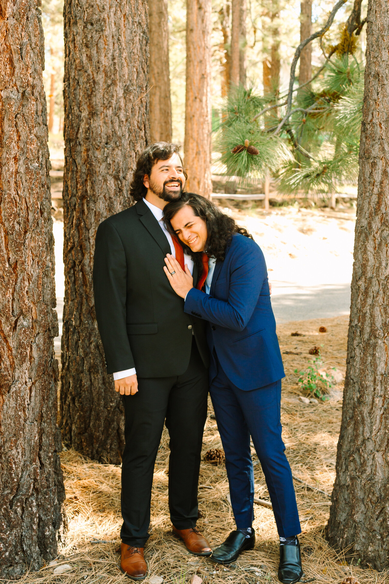The bridal party celebrates an intimate elopement at a cabin at Big Bear Lake, California.