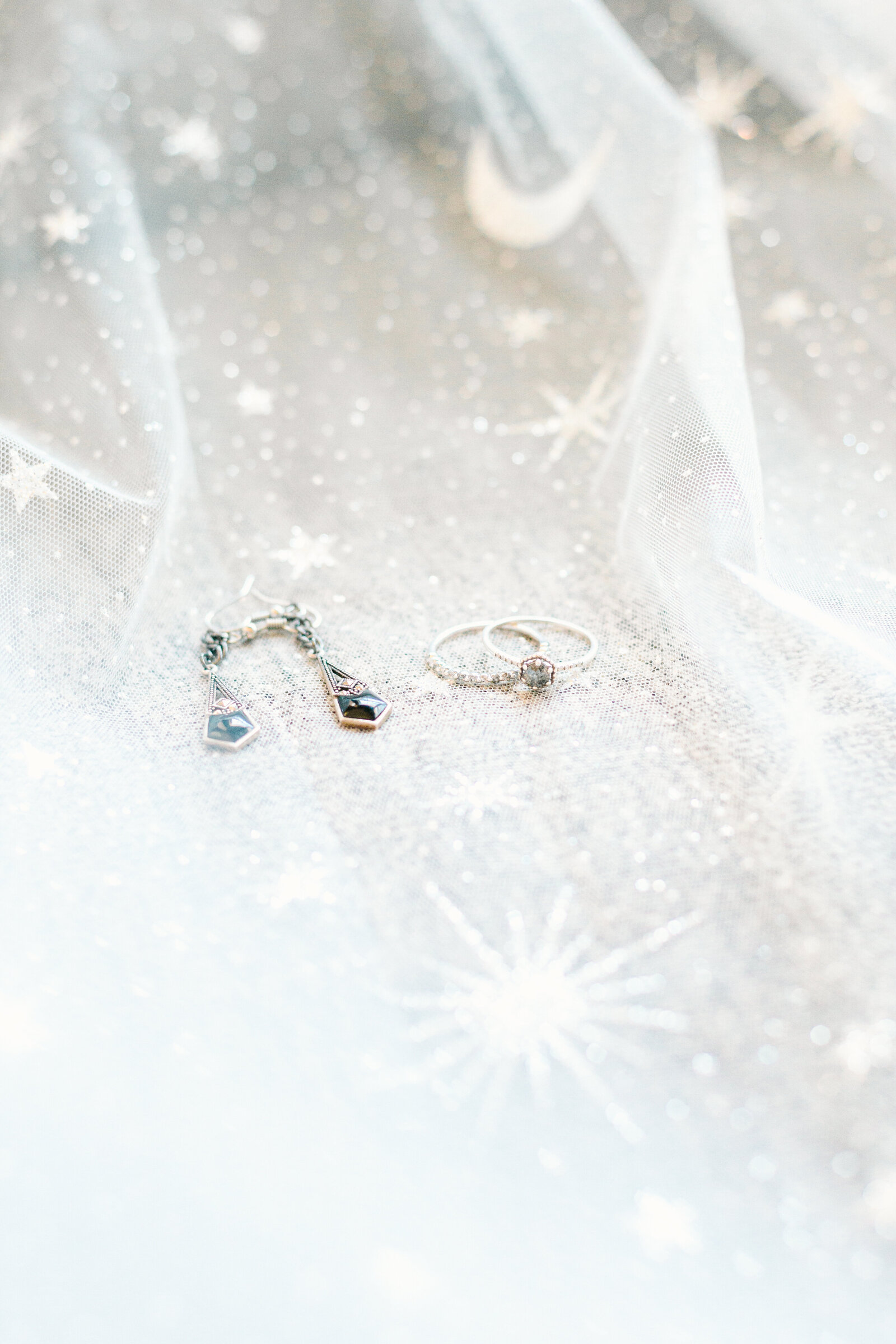 Star and moon veil with bridal jewelry.