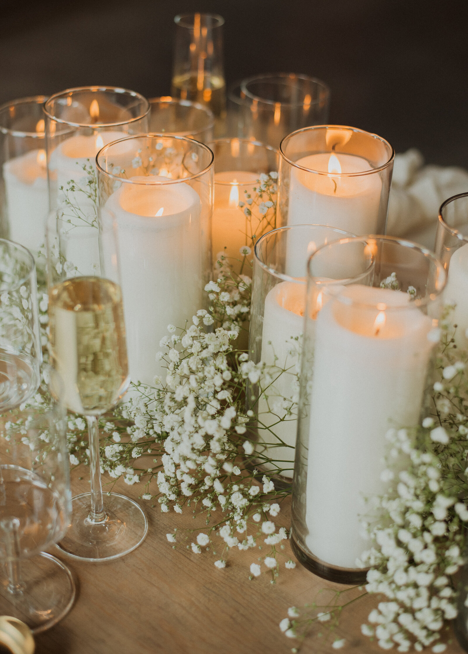 White candles burning on table