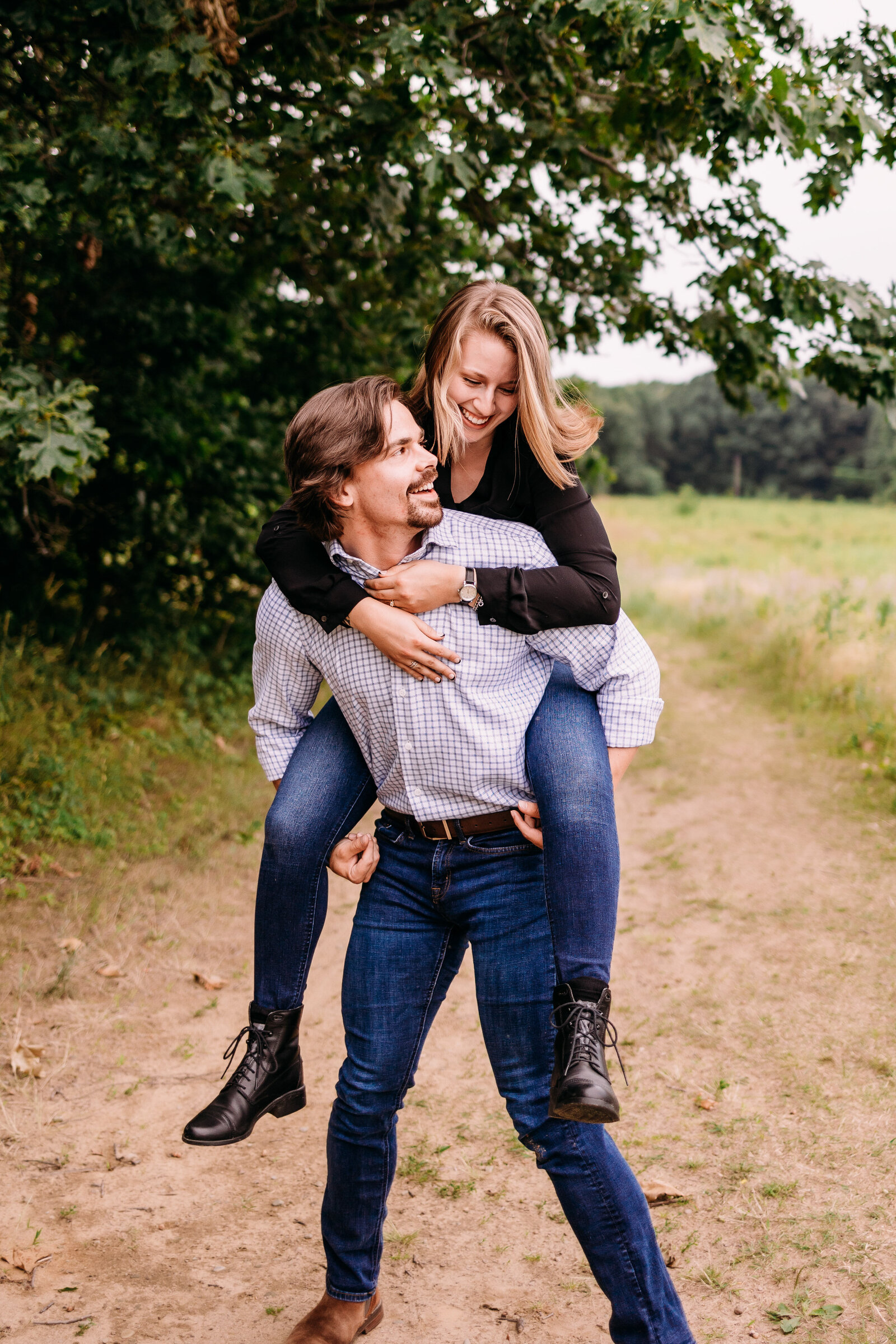 Man gives girlfriend a wild piggy back ride during their couples session