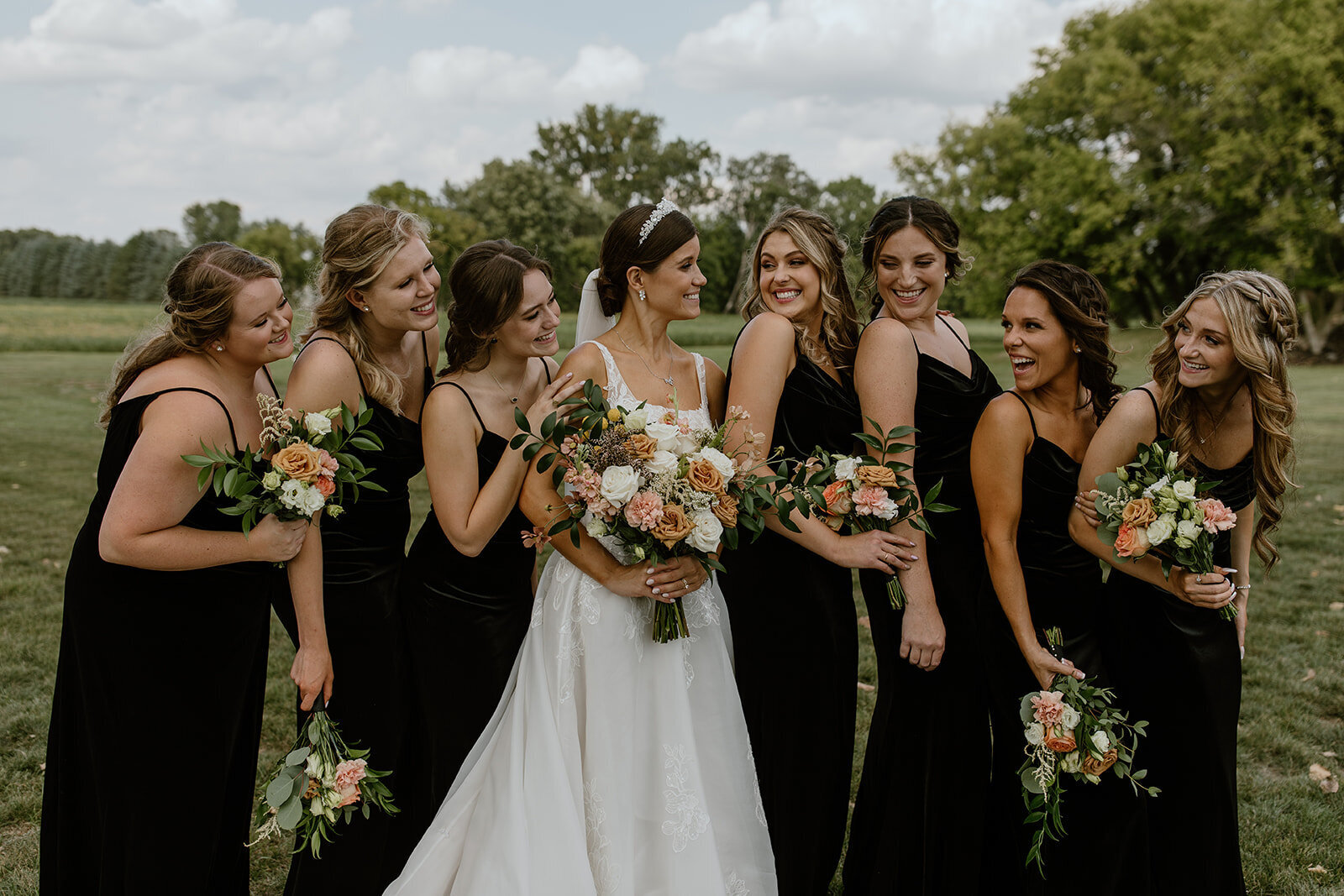 Bridesmaids black dresses luxury flowers