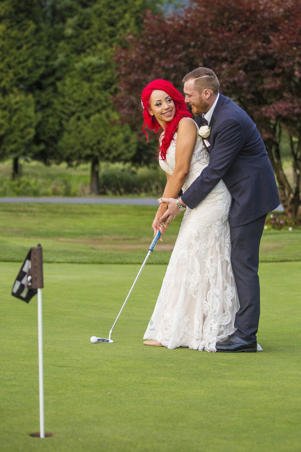 bride and groom playing golf