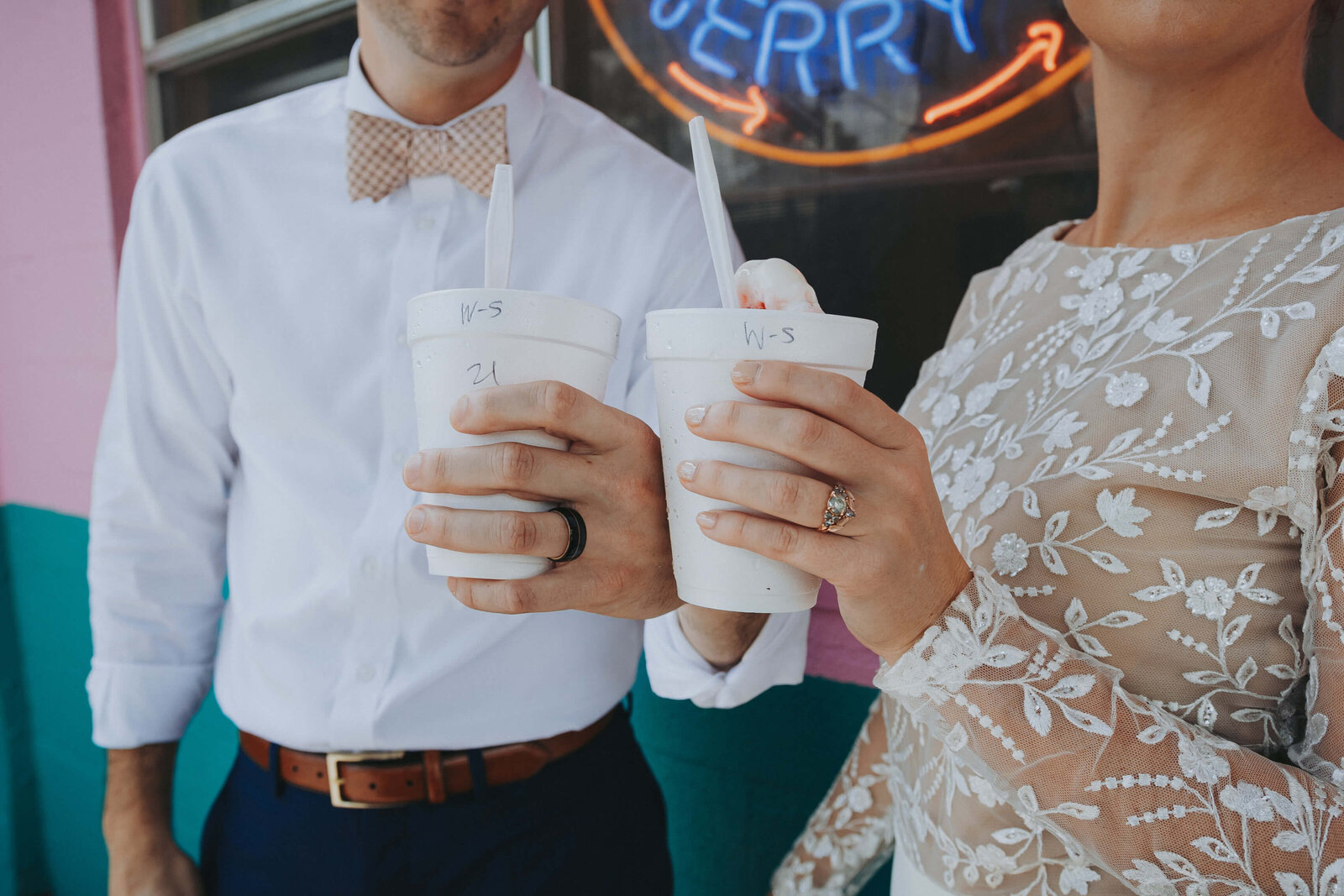 The newly married couple shares a wedding cake sno cone together after their intimate courthouse wedding