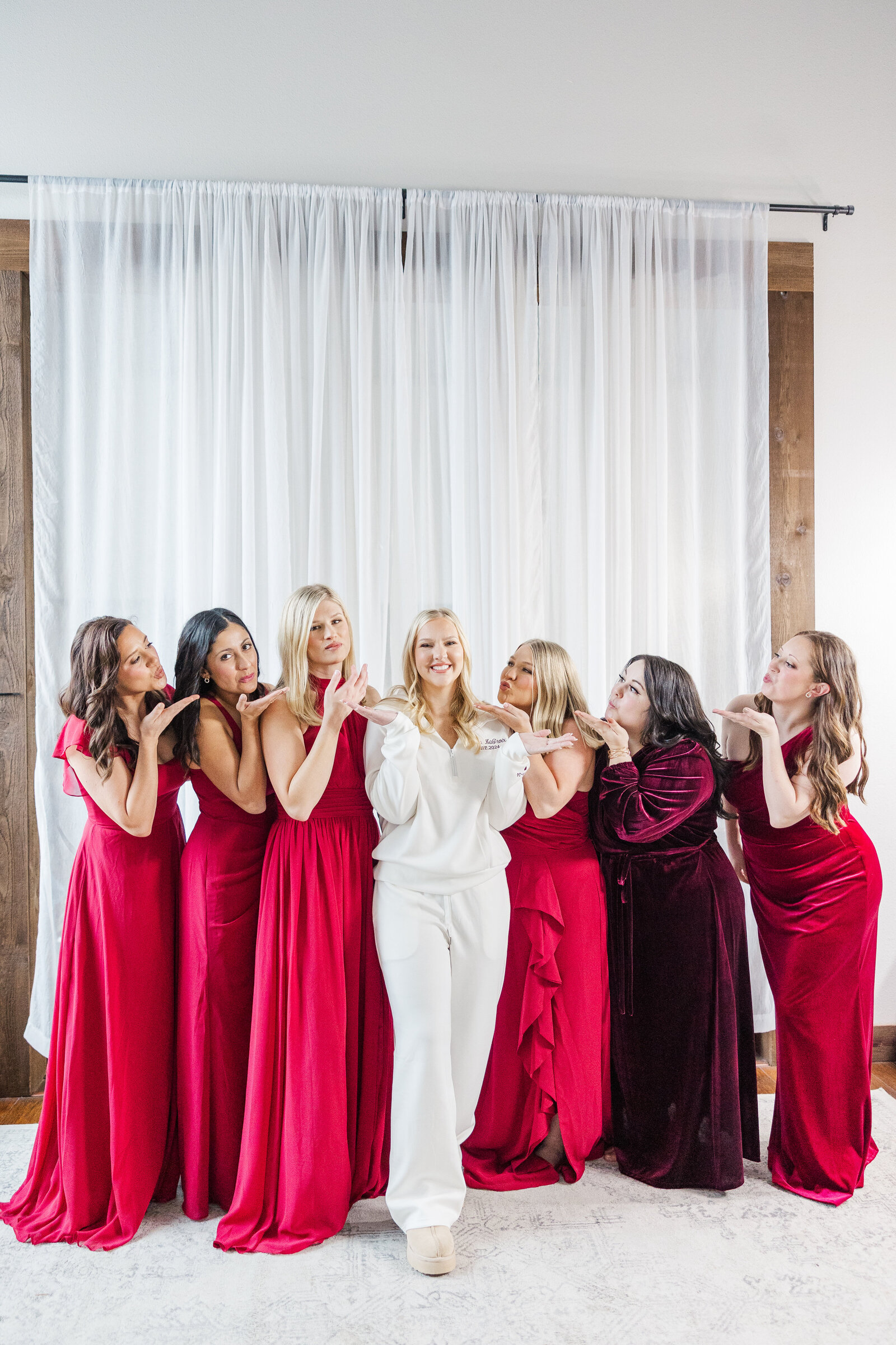 Posed photography for bride and bridesmaids during getting ready for wedding