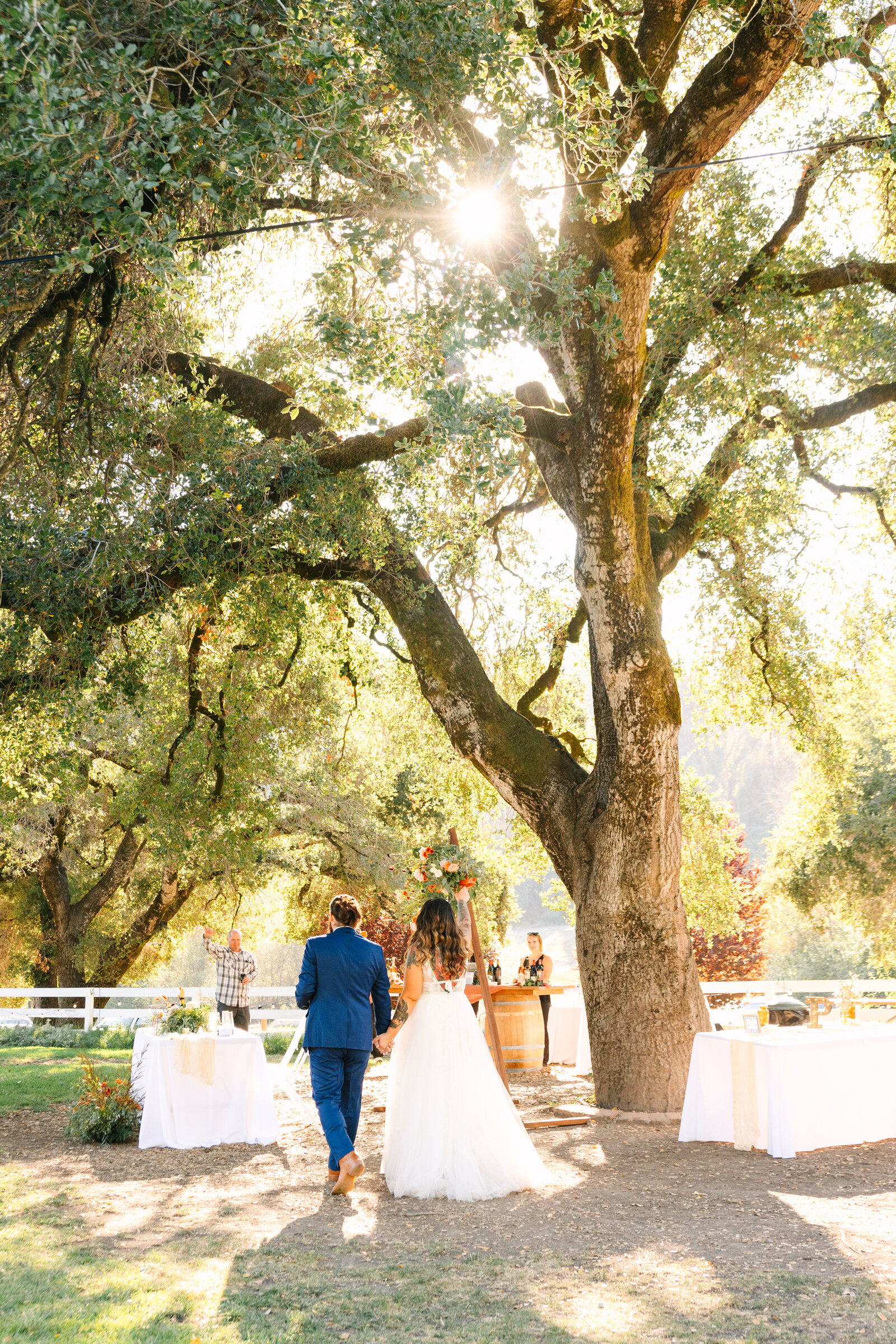 Tattoo bride and groom at their colorful wedding reception in Santa Cruz, California.