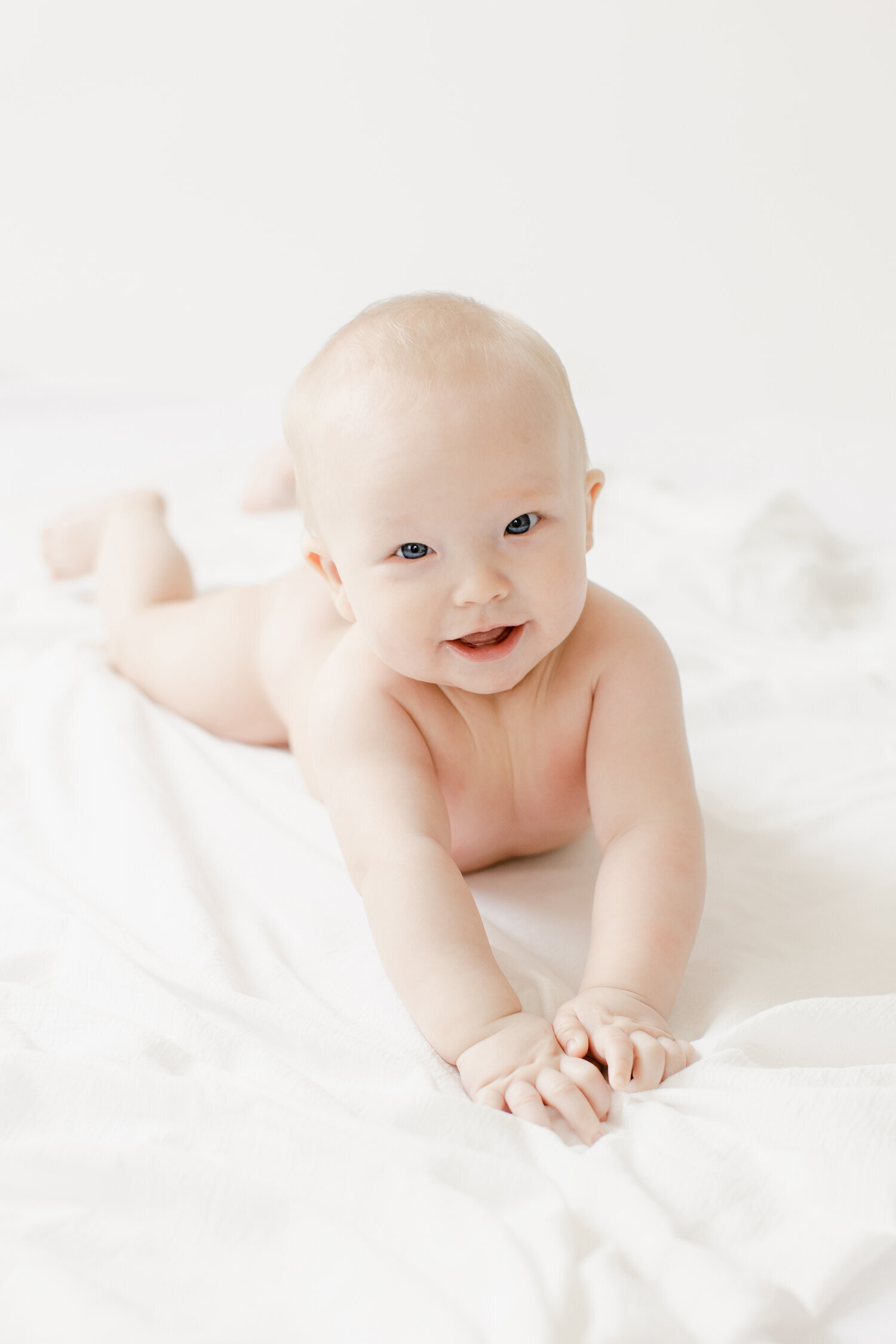 Simple joyful six month old baby in NWA photography studio
