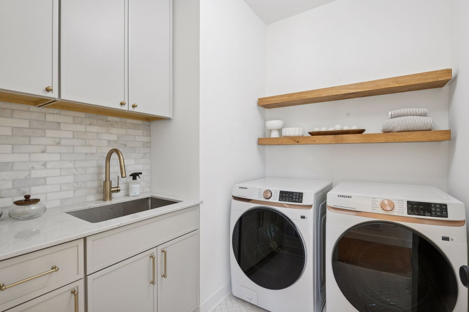 4404 West 58th Street - Upper Level Laundry Room with Stylish Designer Tile Finishes