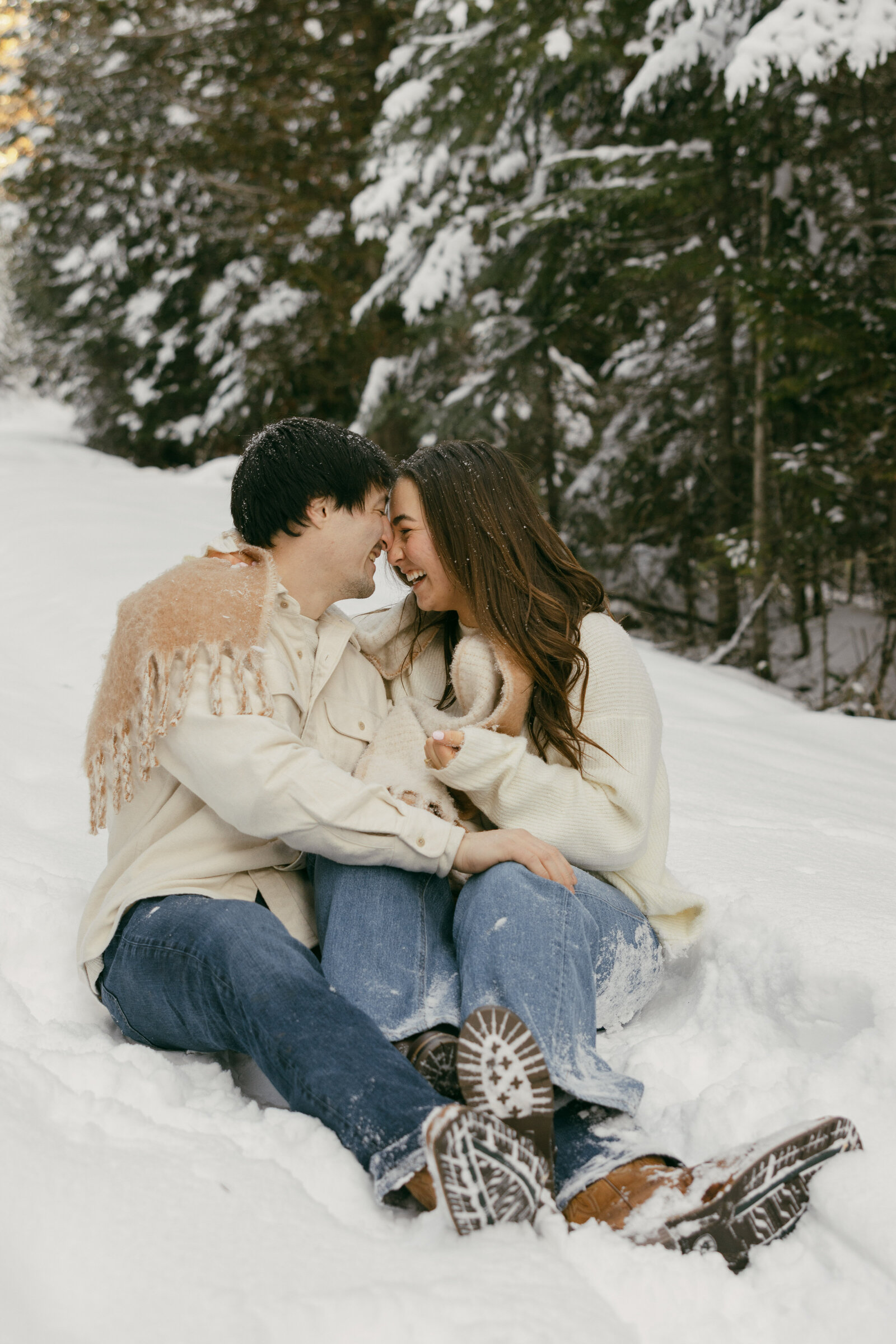 couple sitting in snow