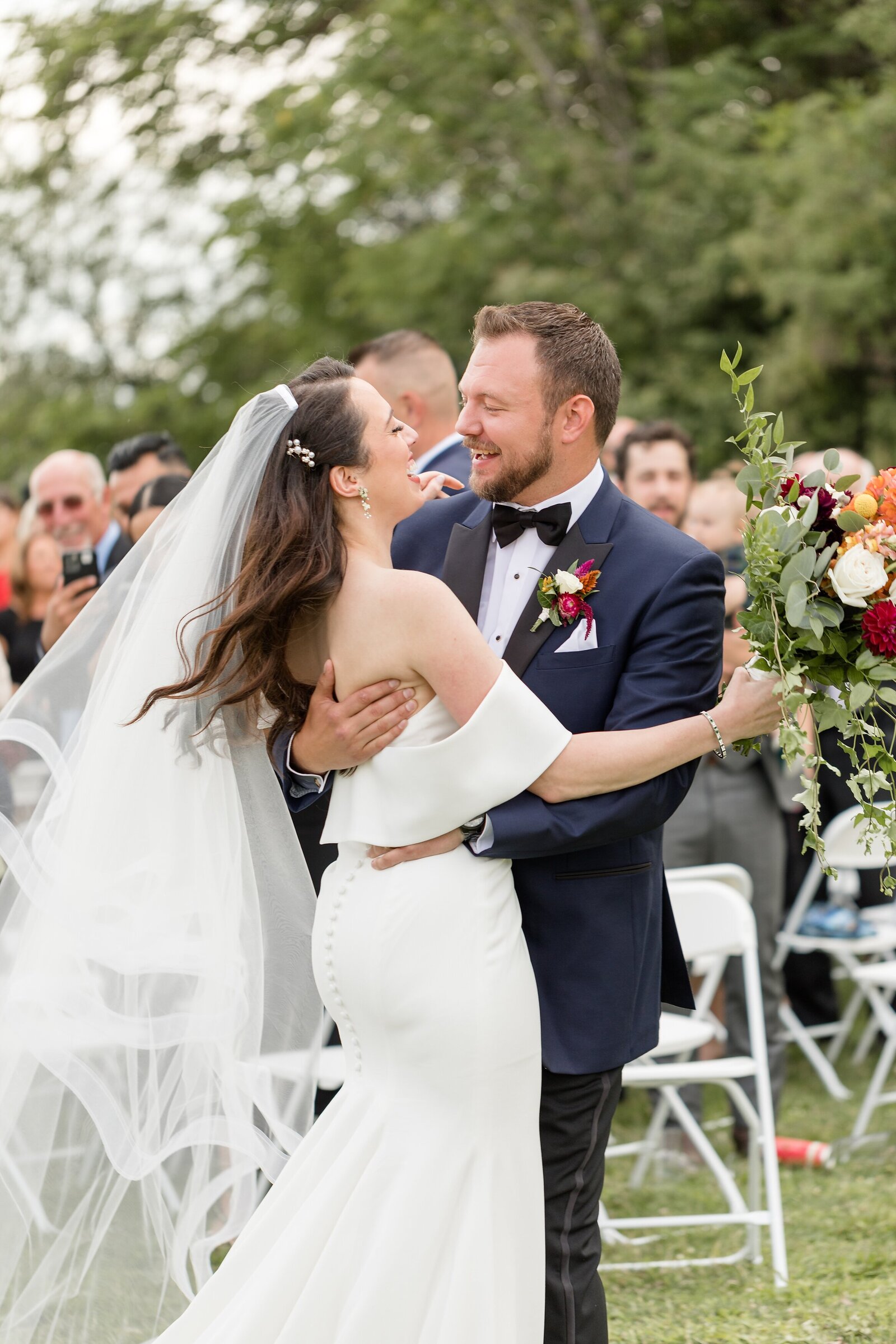 Groom-Embraces-his-newly-wed-Jewish-Bride-after-their-wedding-ceremony