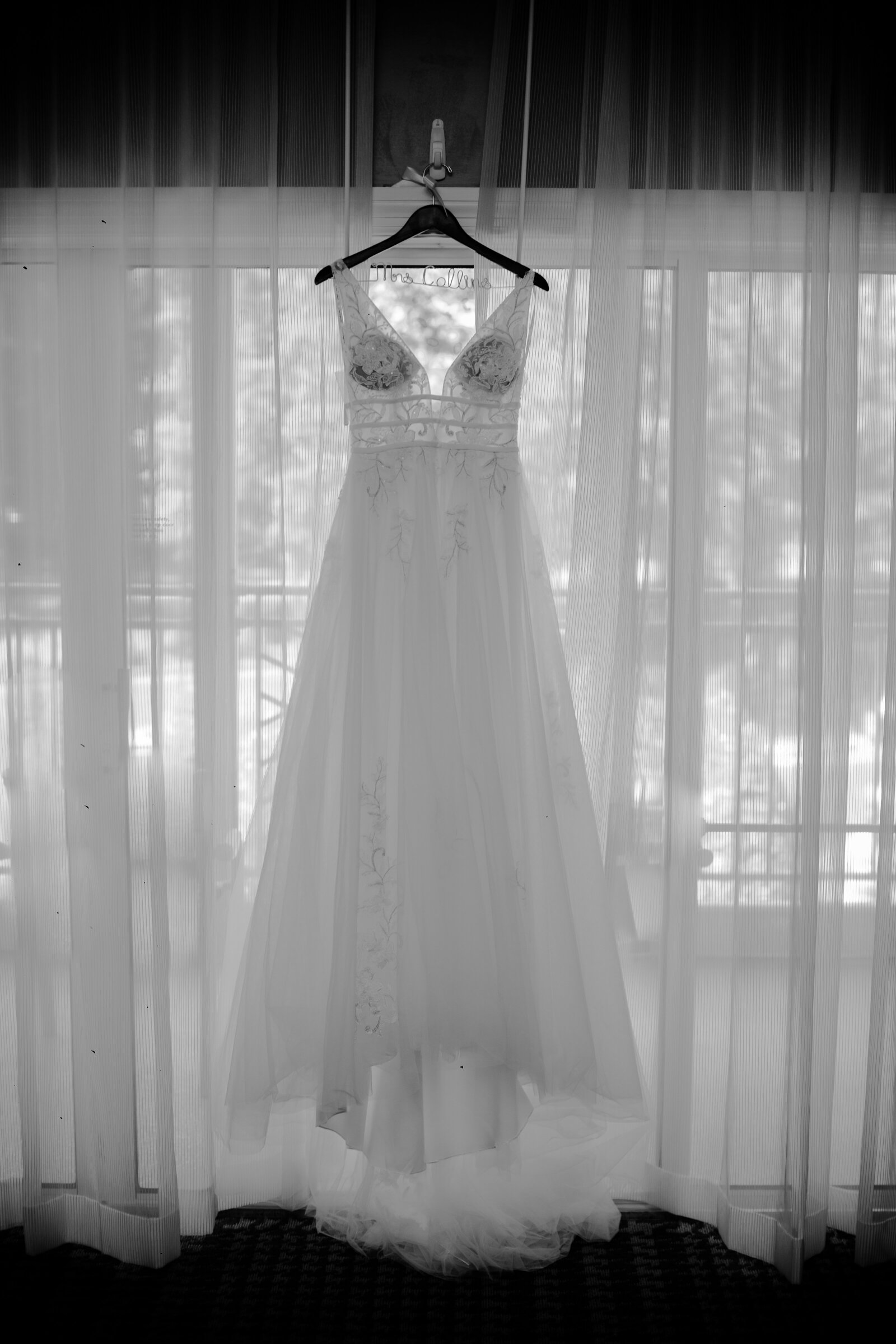 wedding dress handing above window