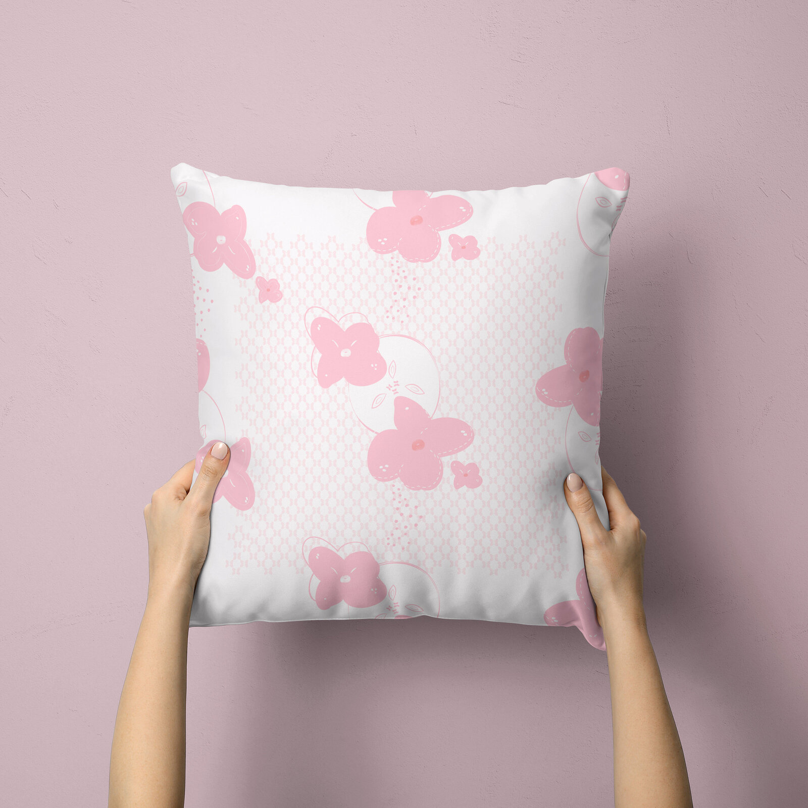 white and pink floral pillow