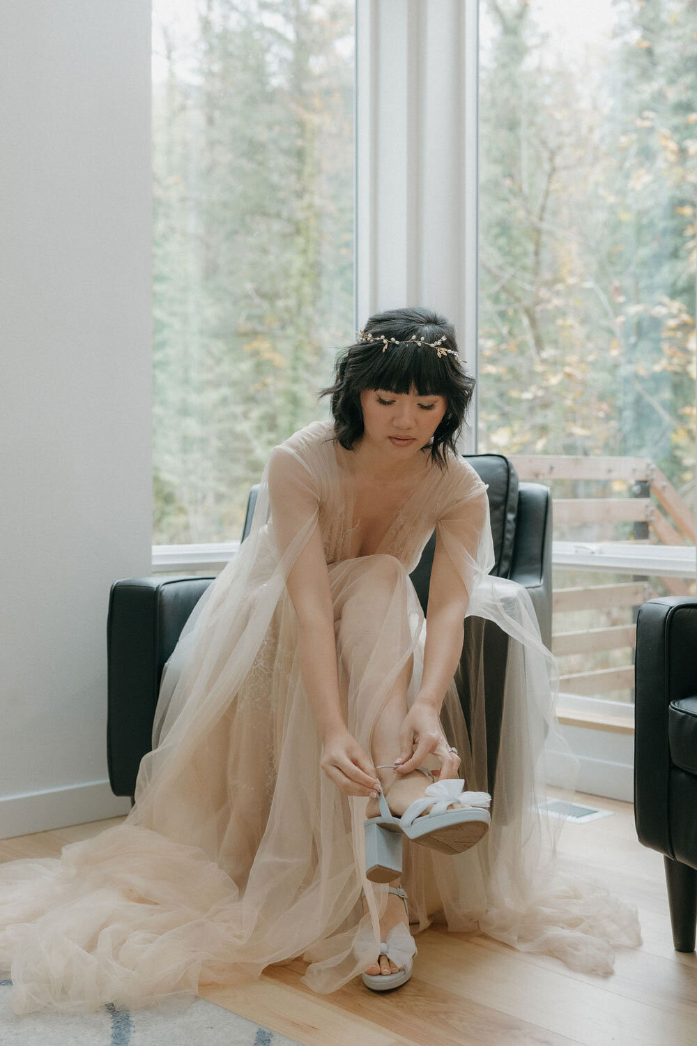 Bride fixing her wedding heels