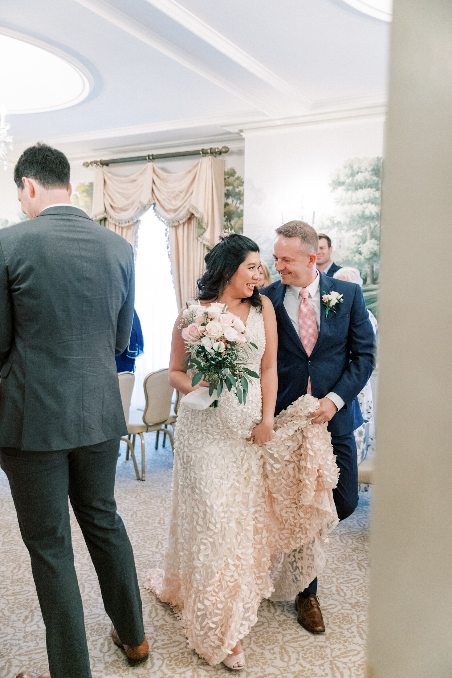 Couple just got married walks out of the Hay-Adams Hotel