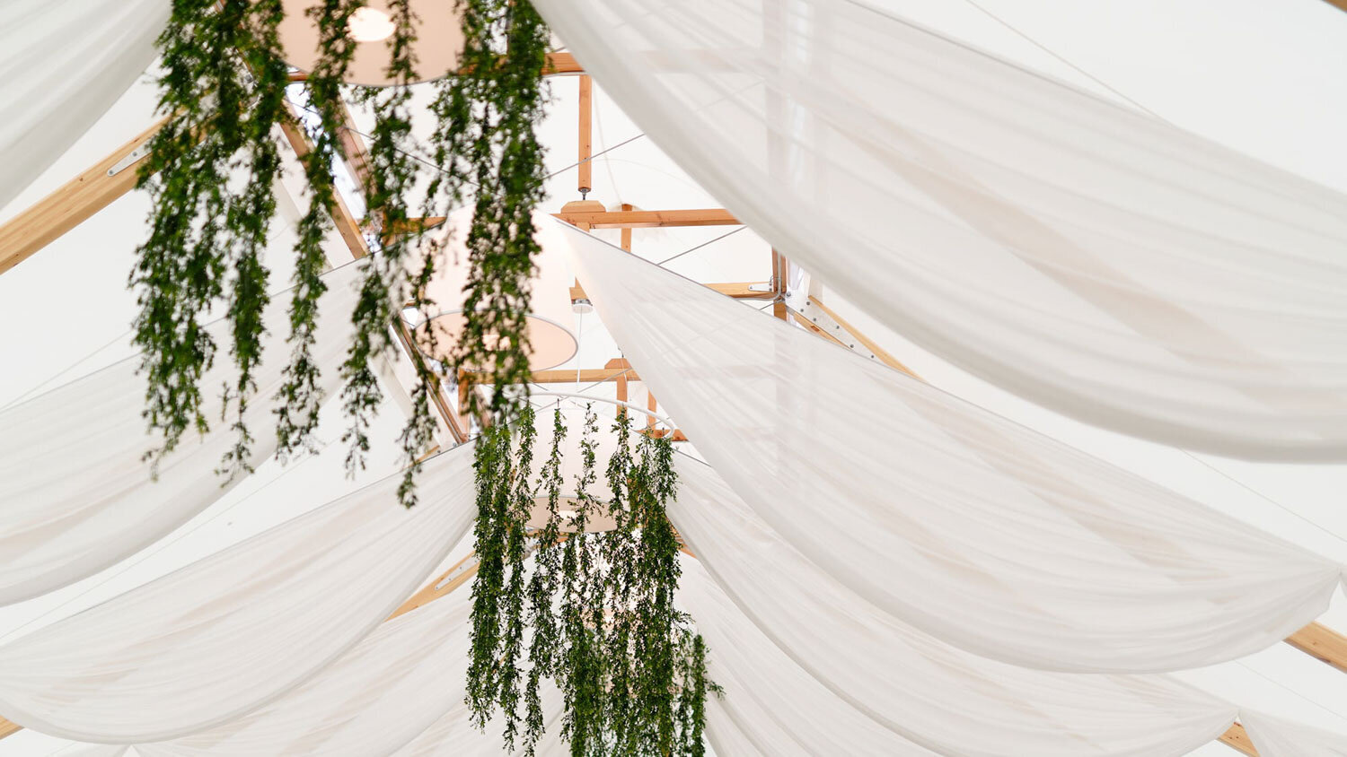 Elegant hanging decor and draping for a wedding reception