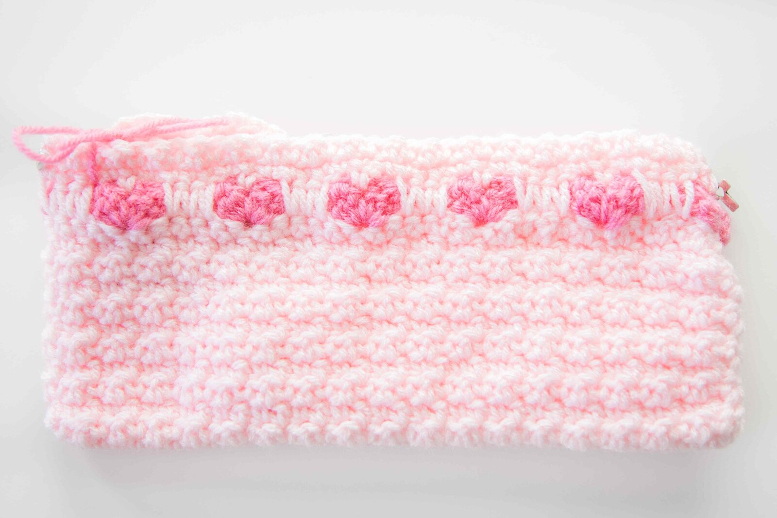 pink knitted cradle for stillborn baby in heaven
