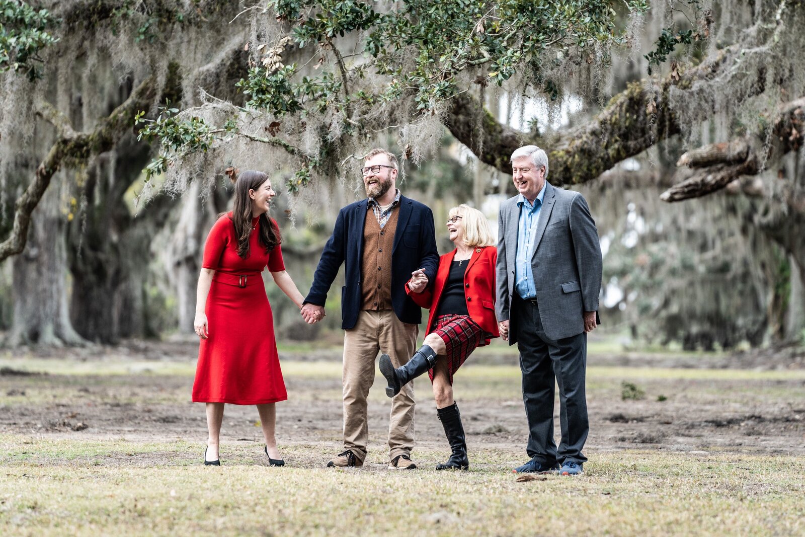 Family walking among large oak trees at Fontainebleau State Park