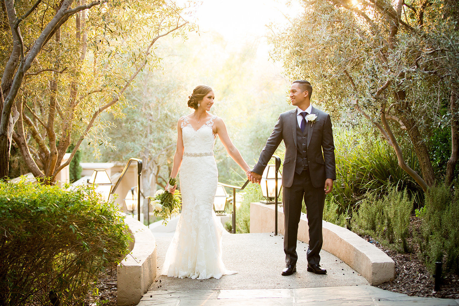 Bride and groom in a beautiful garden setting at Rancho Bernardo Inn