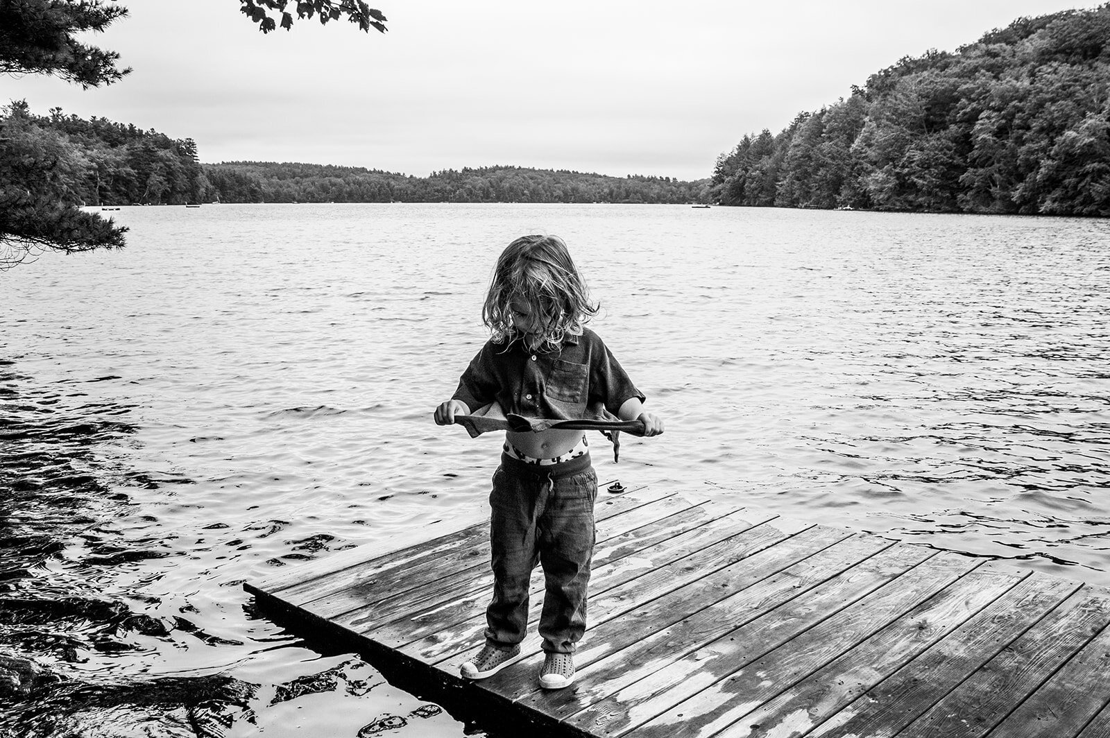 A black and white photo berkshires captured in a documentary-style family photography session.