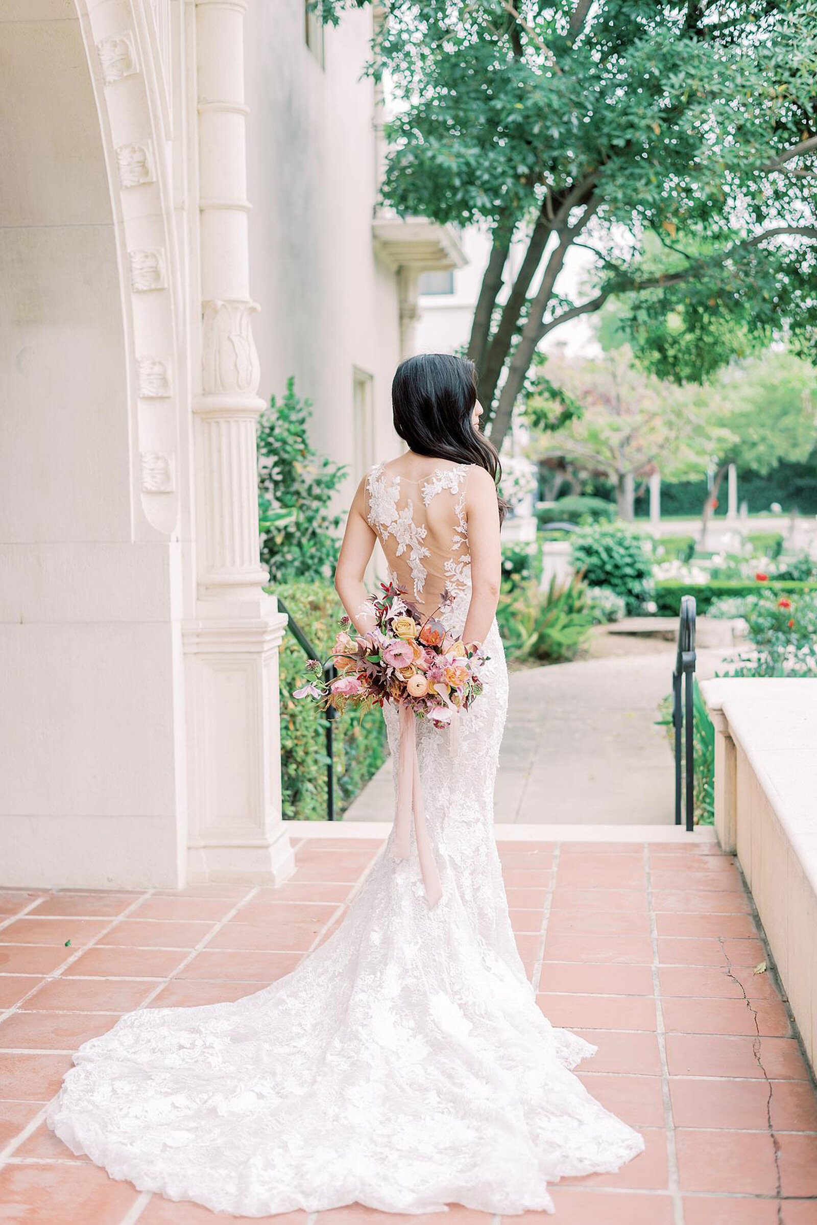 1-radiant-love-events-outdoors-back-of-bride-holding-bouquet-behind-her-showing-dress-train-updated-romantic-elegant-timeless
