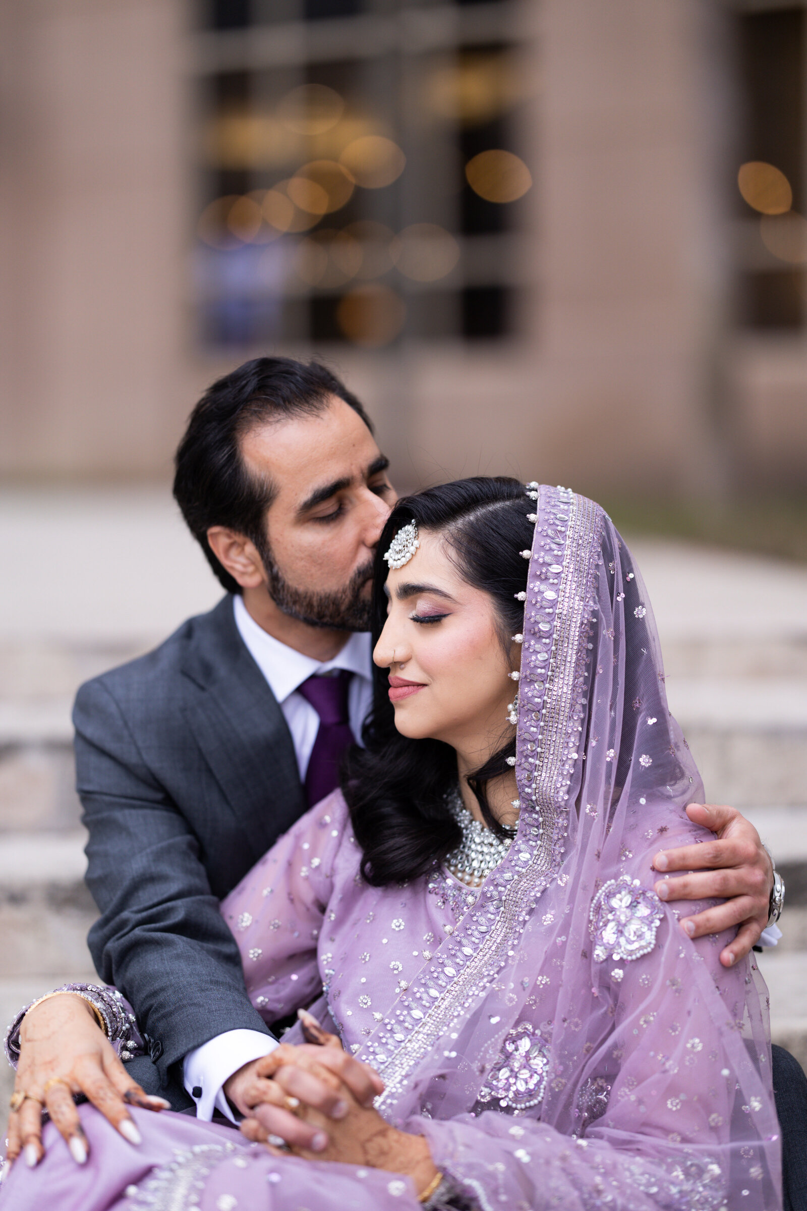 Groom-kissing-bride-forehead