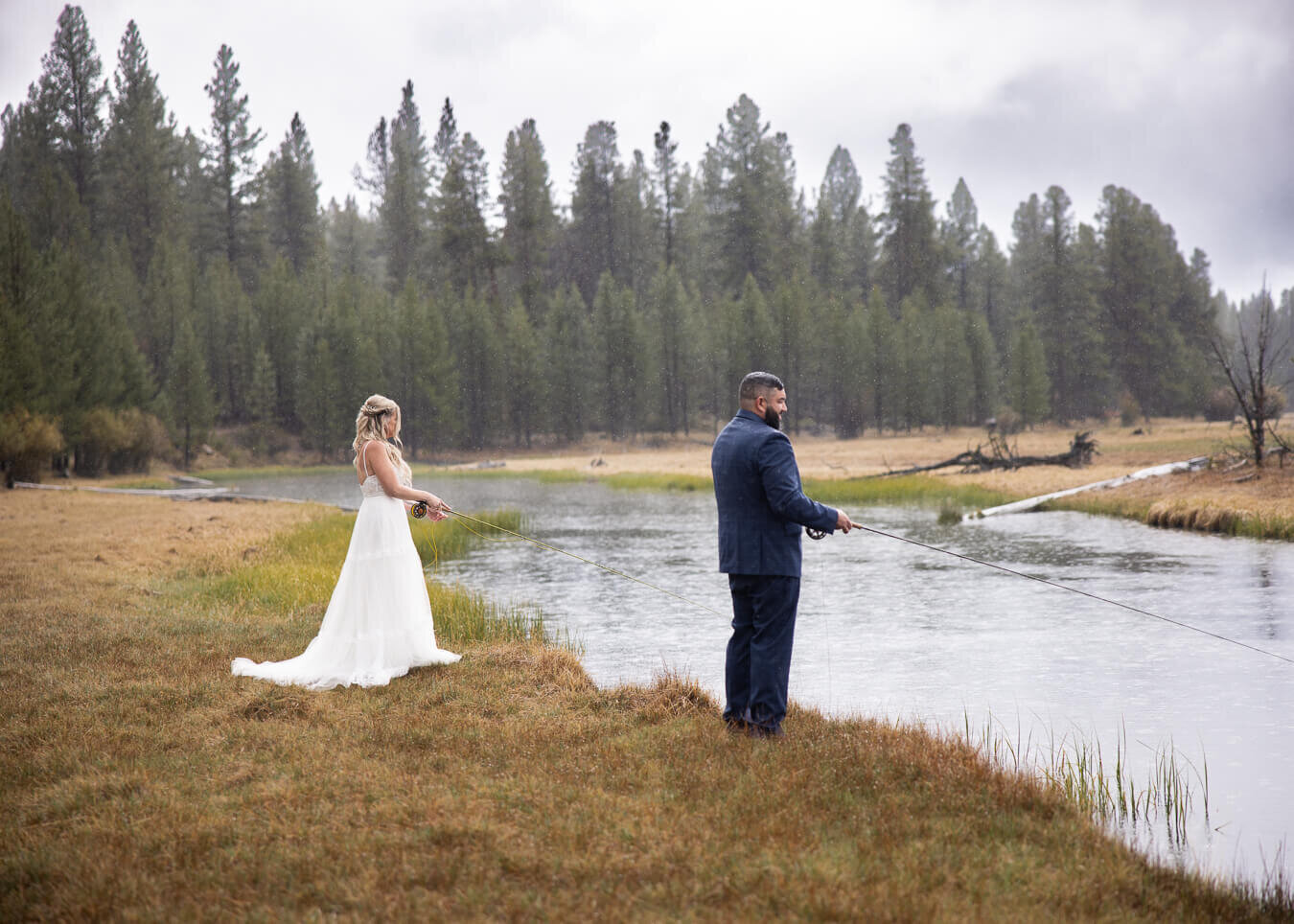 Bride and Groom fly fishing in the rain