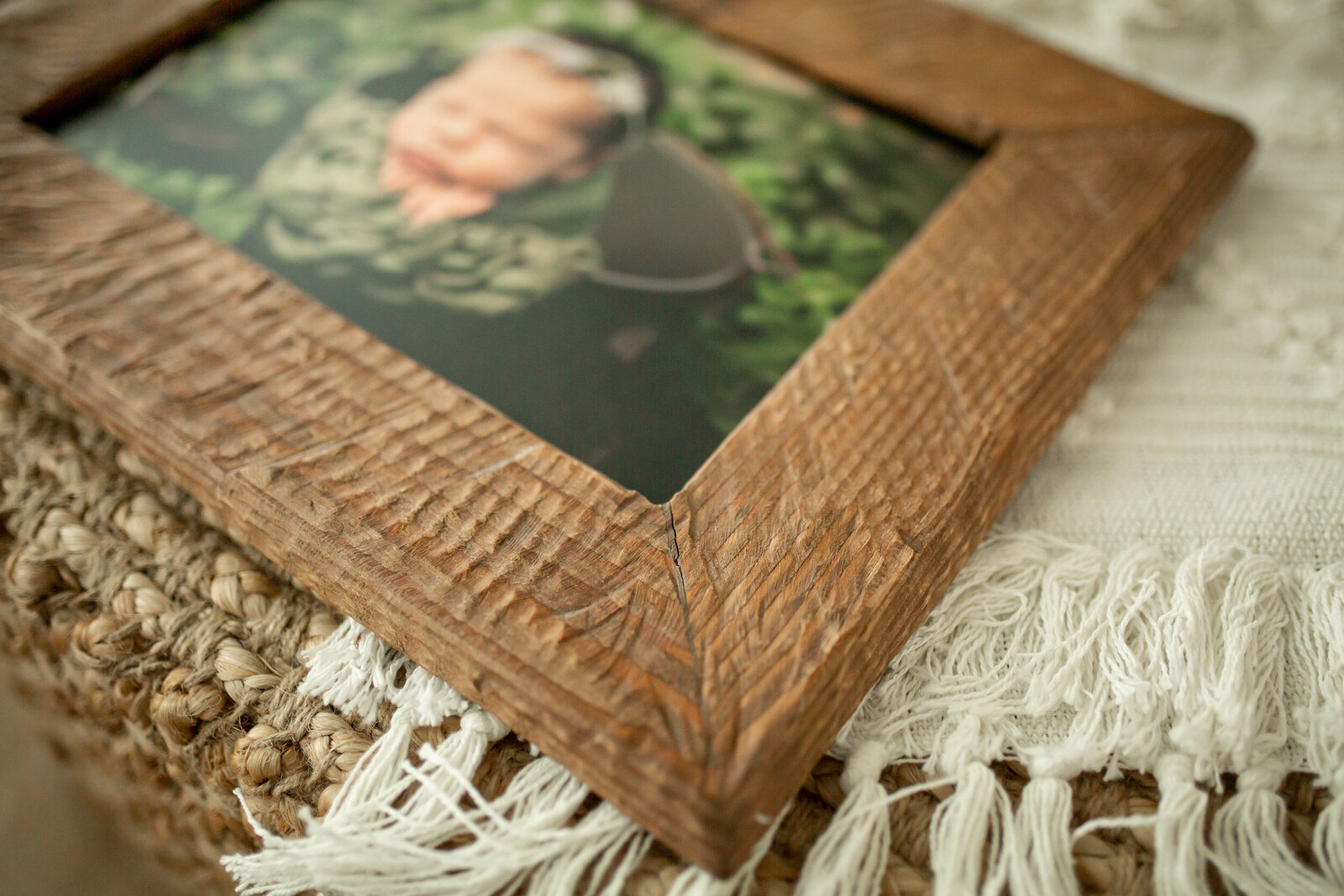 close up of rustic wooden frame for newborn photo
