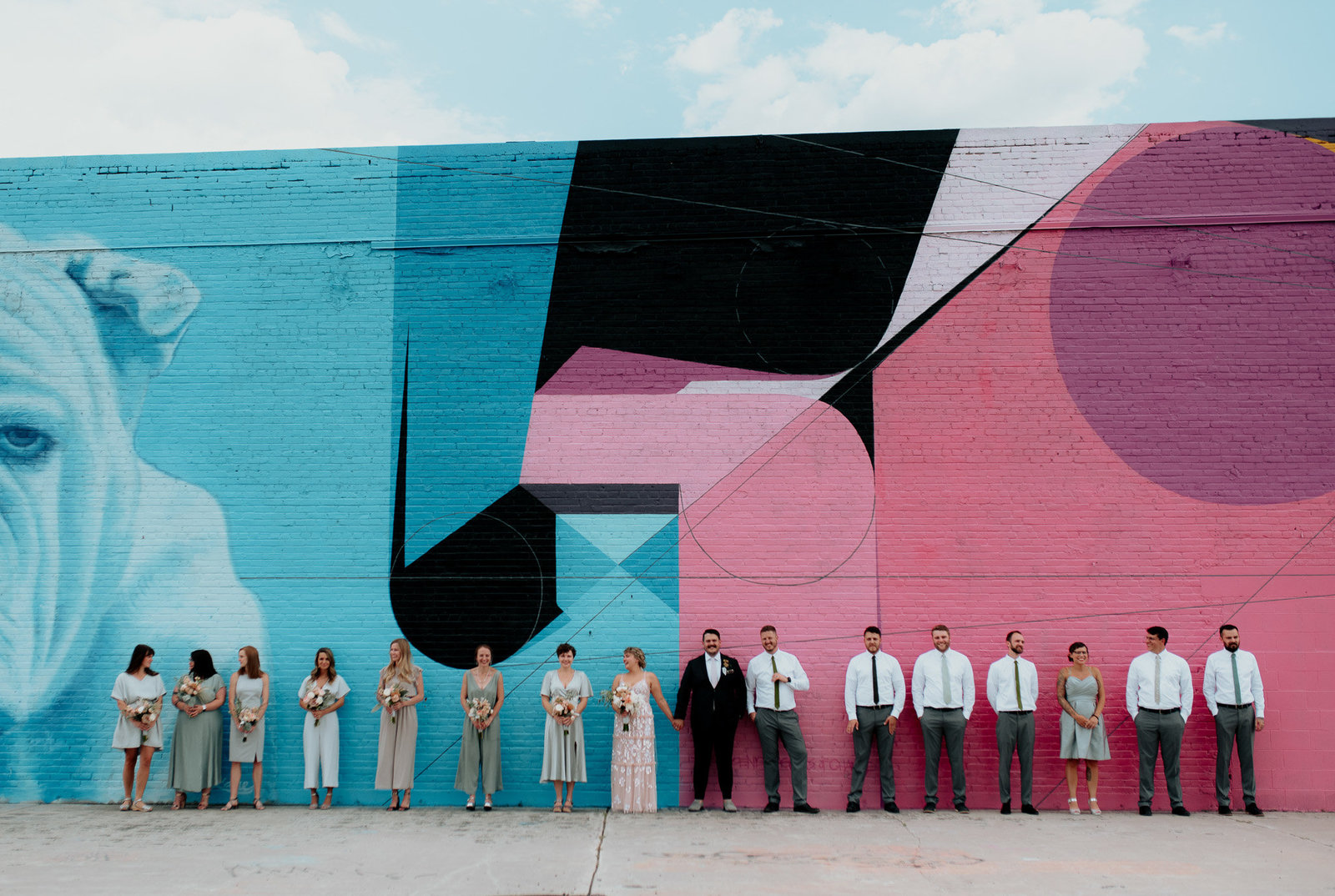 contemporary mural in Denver with wedding party
