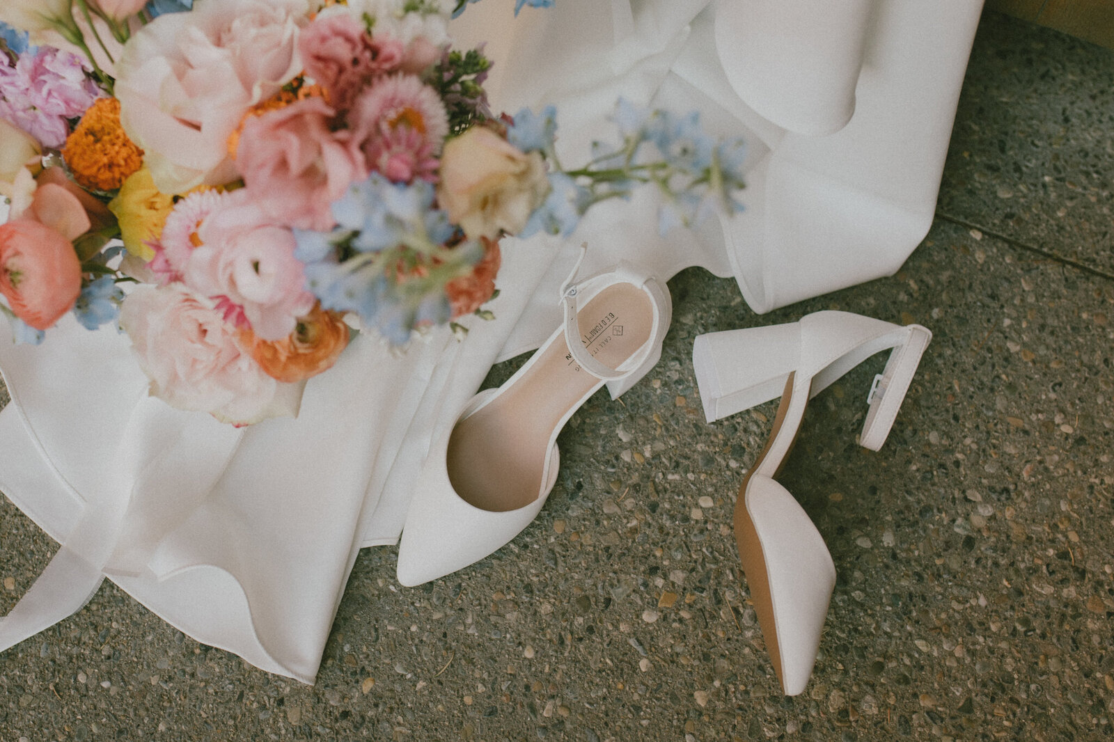 detail photo of bridal bouquet and shoes at fernie wedding