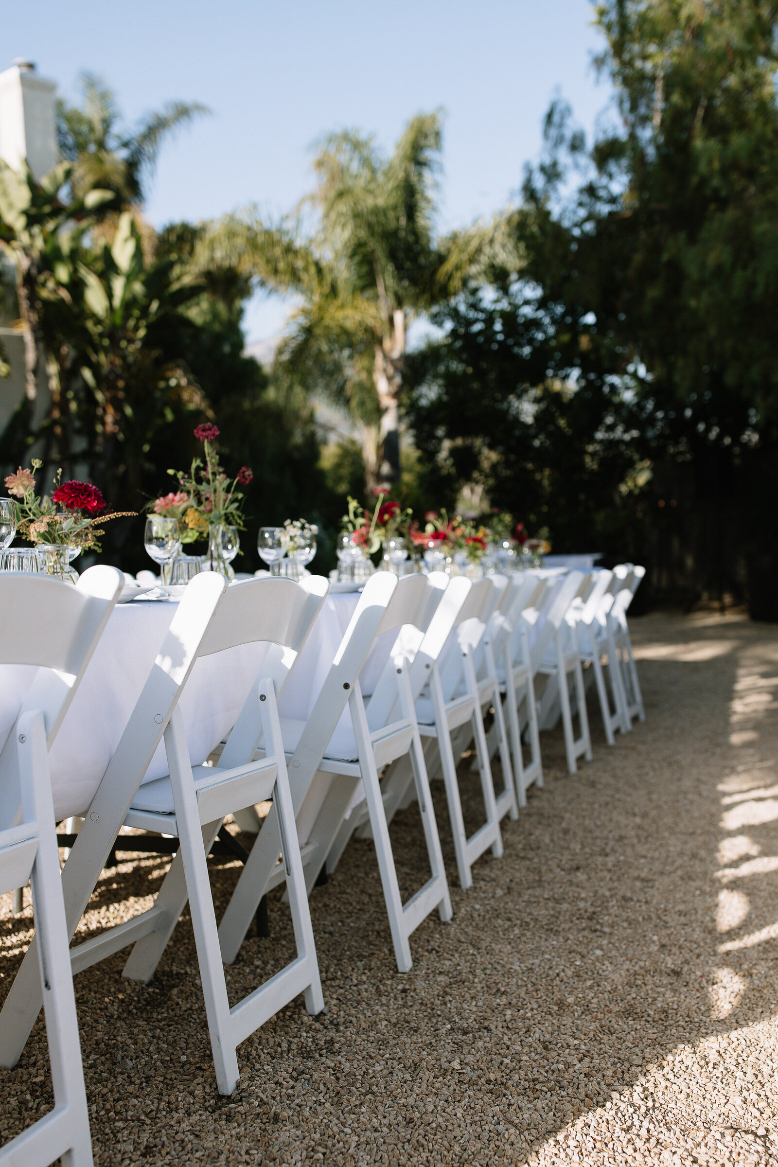 Close up details of reception tables with florals by Northern California wedding photographer, Erica Rochelle