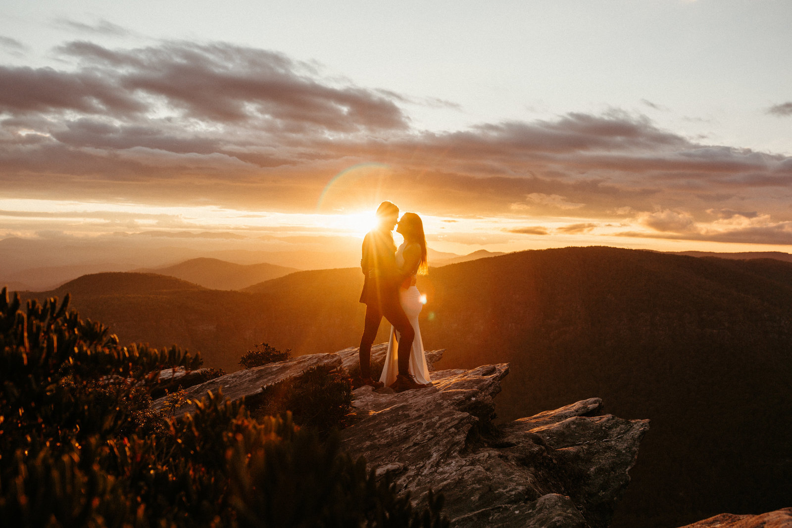 Mountaintop Sun Flare Golden Hour Wedding Couple