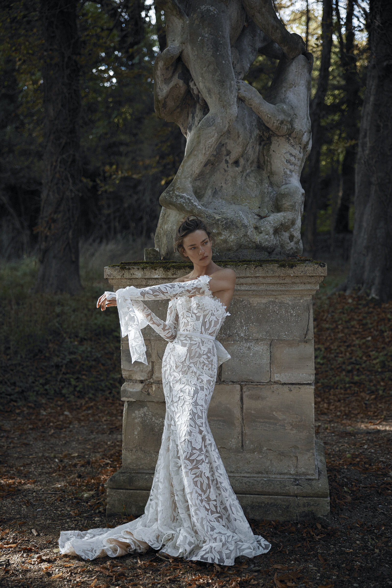 bride wearing white lace wedding dress with long sleeves
